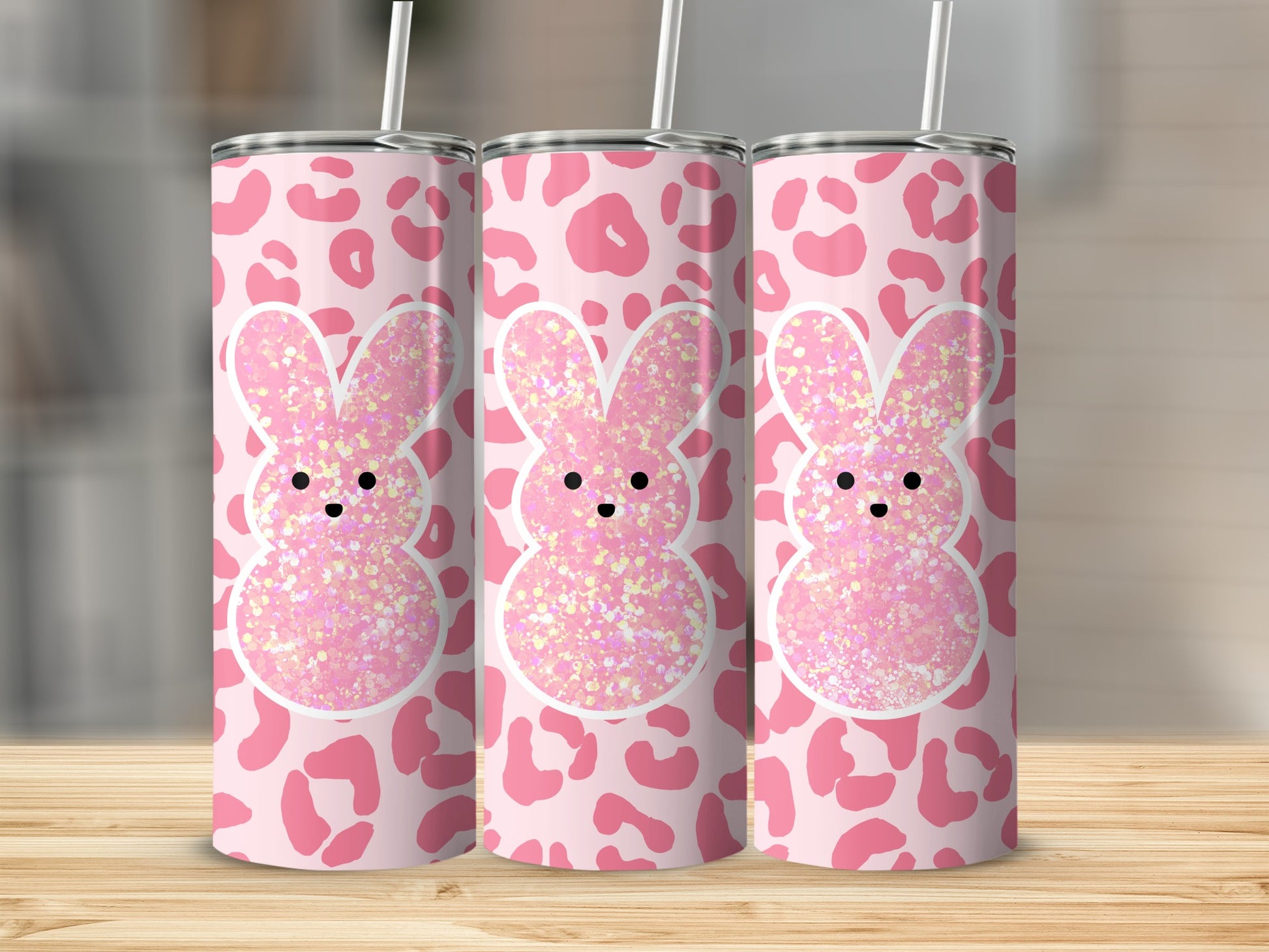 Pink cheetah print tumbler with glitter bunny design and straw.