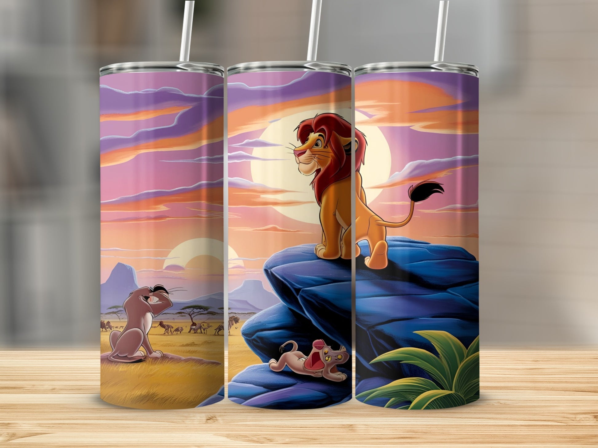 Simba and Nala from The Lion King on a rock formation at sunset.