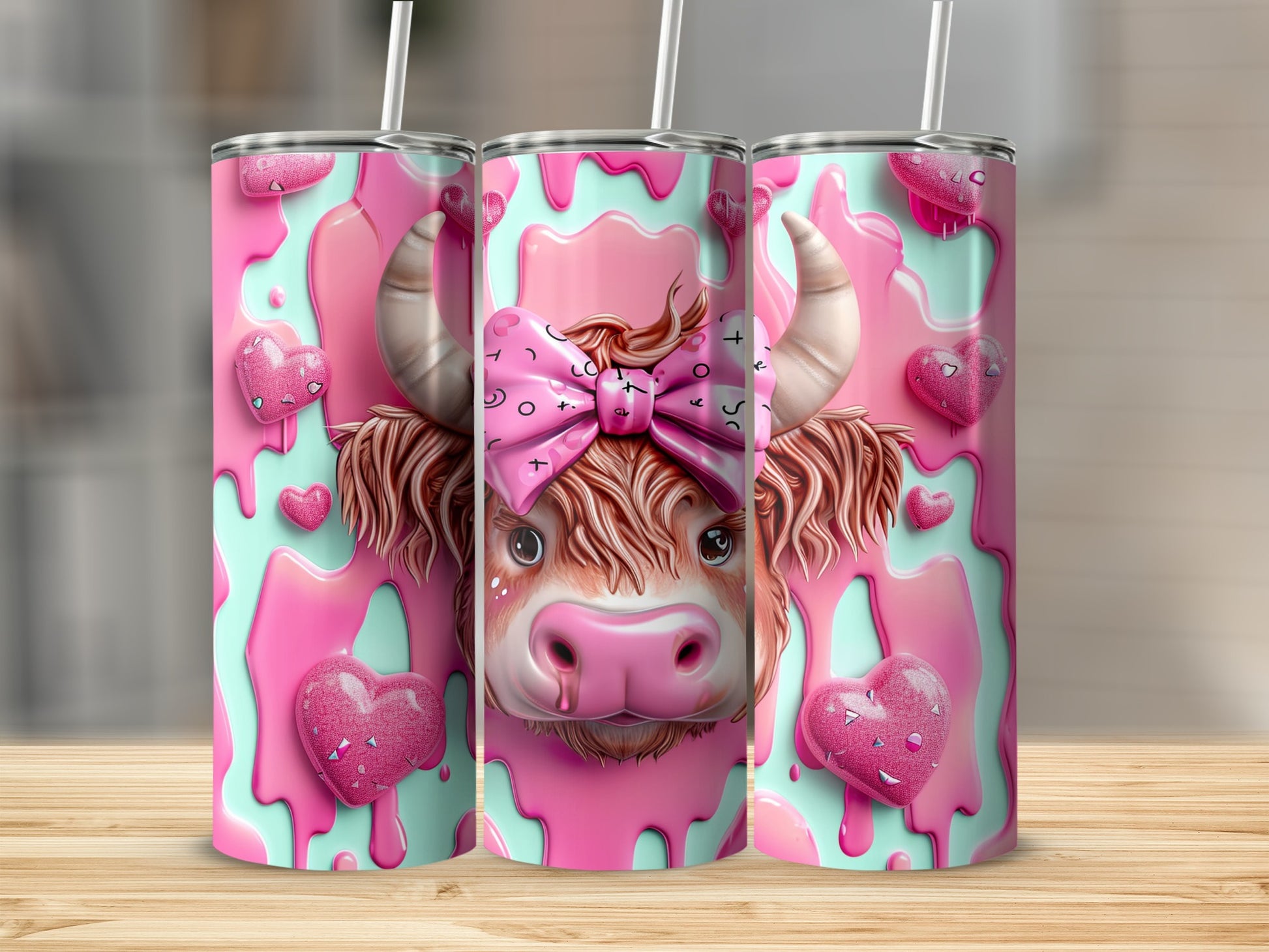 Pink cow tumbler with hearts and a bow.