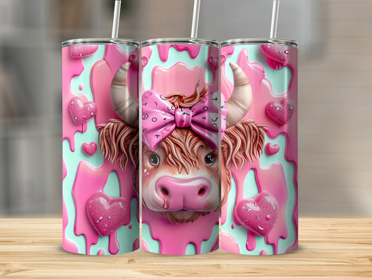 Pink cow tumbler with hearts and a bow.