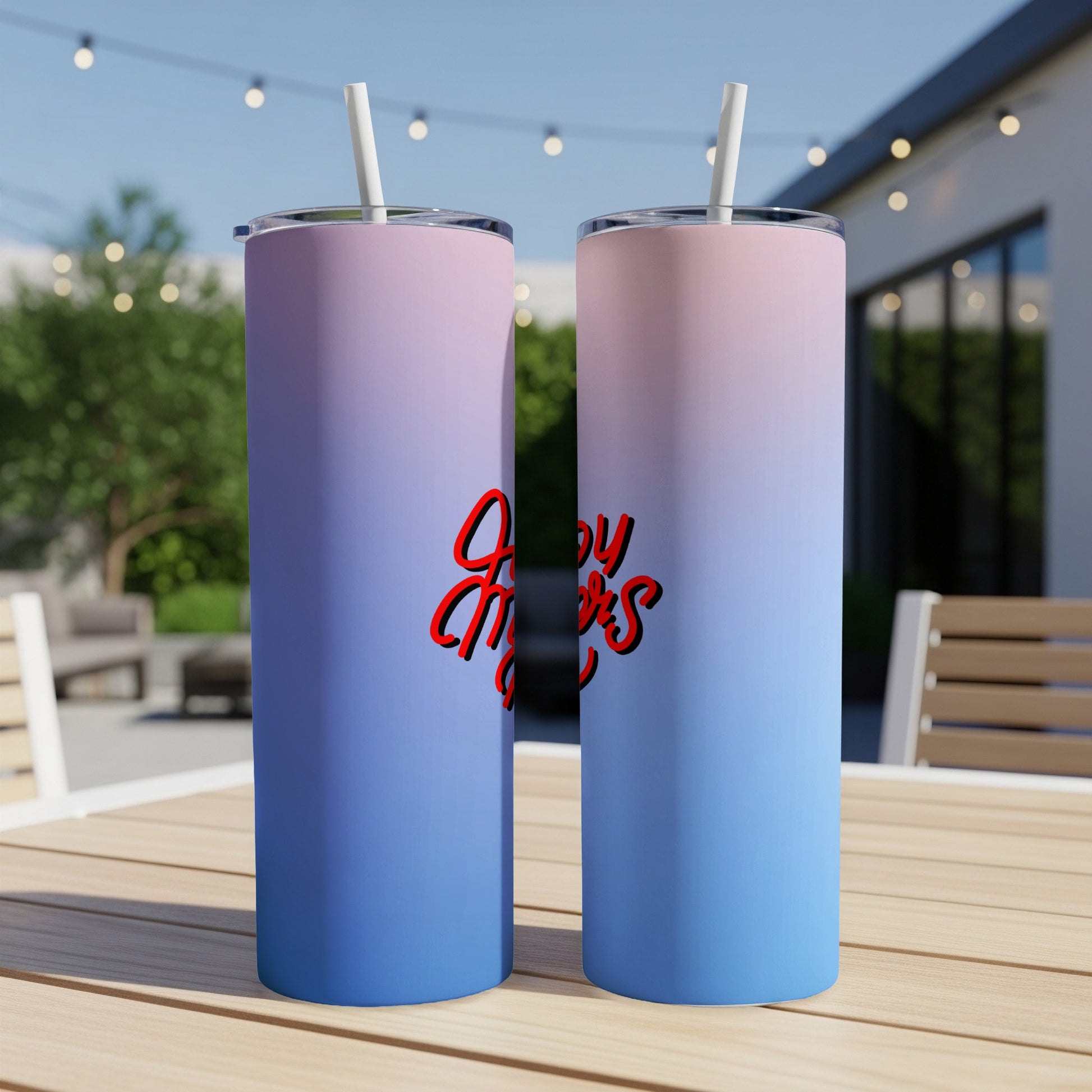 Two tall, insulated tumblers with ombre blue and pink gradient and red "Enjoy More" text.