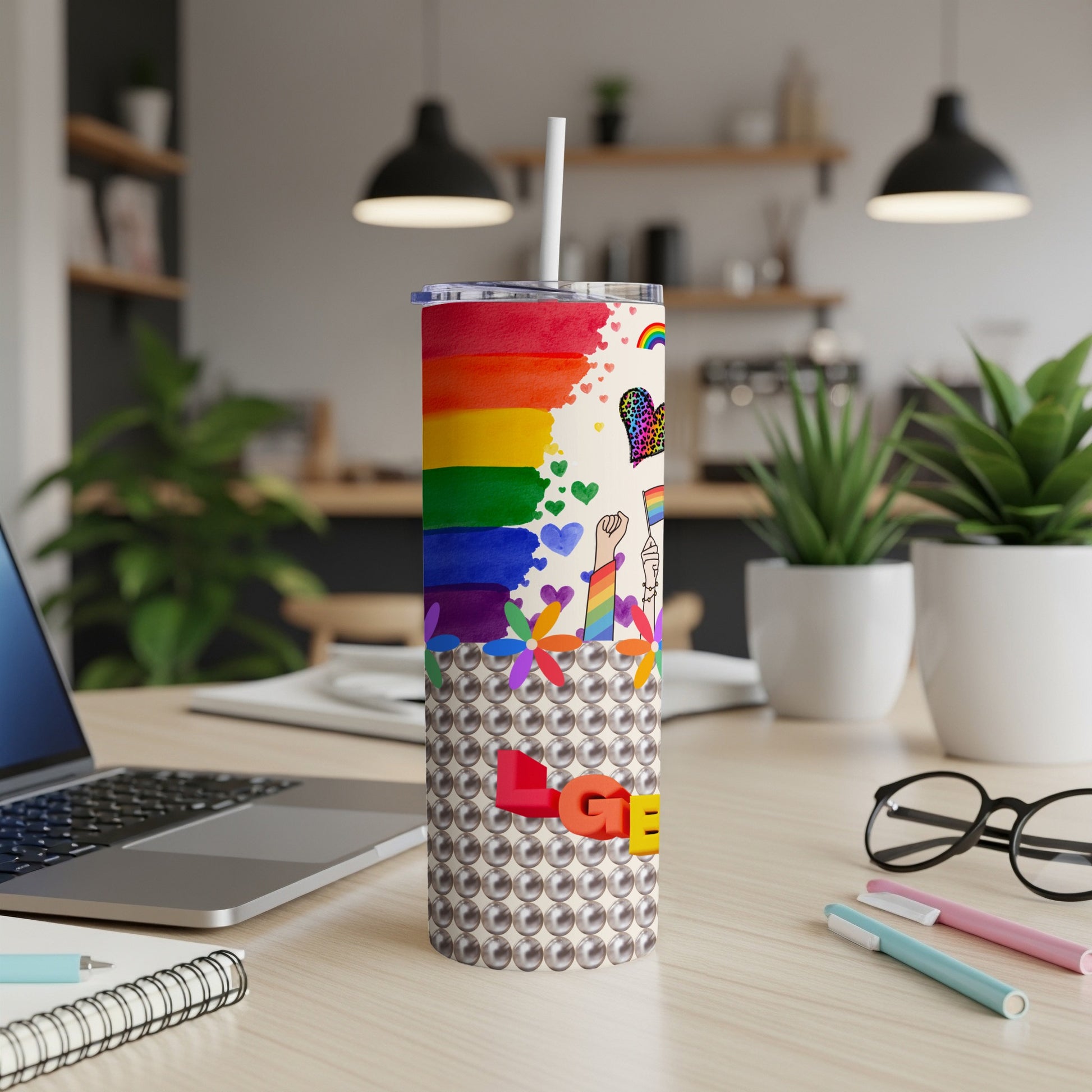Rainbow Pride tumbler with pearl design and graphic elements.