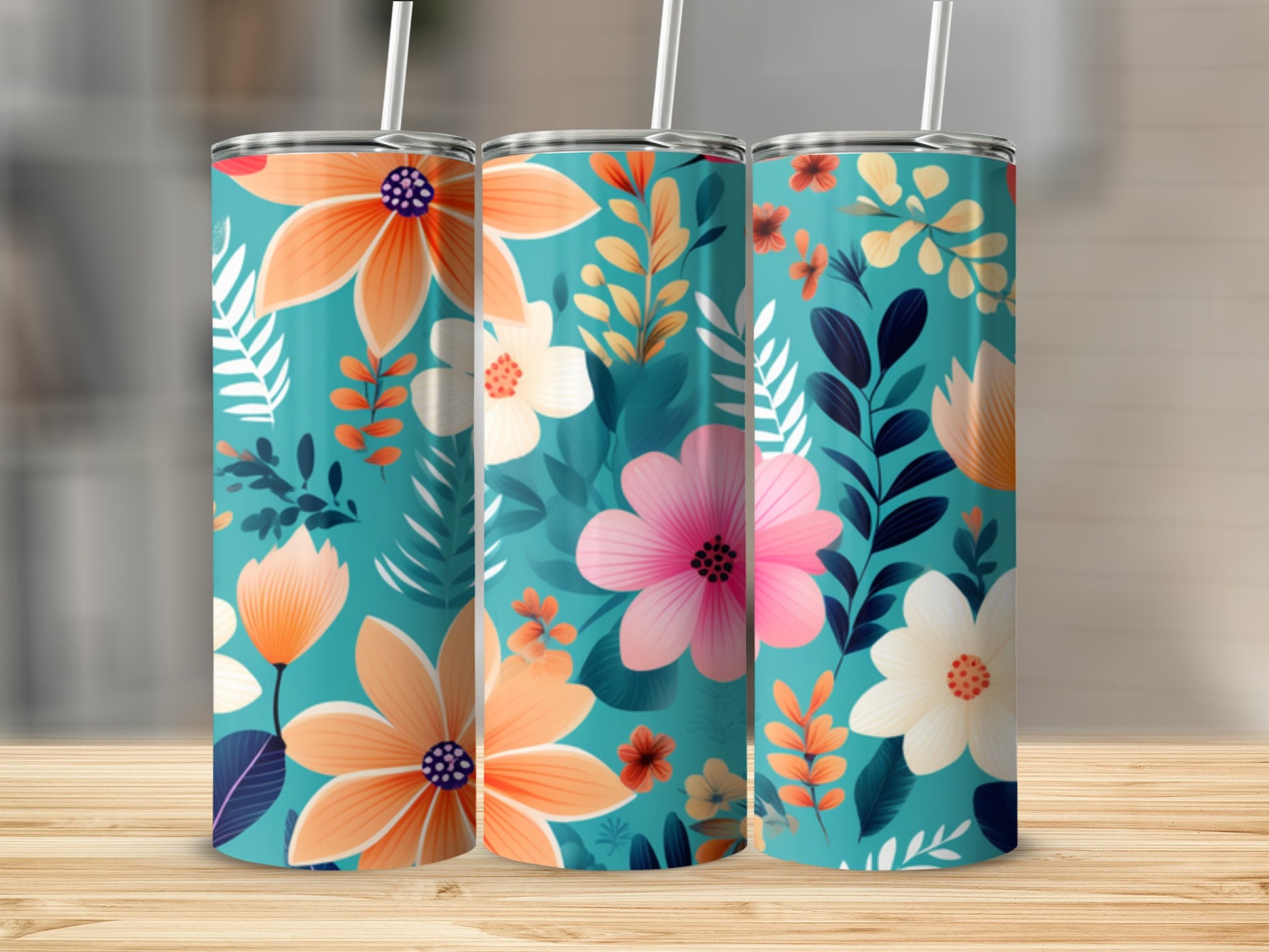 Three teal tumblers with a coral and pink floral pattern.