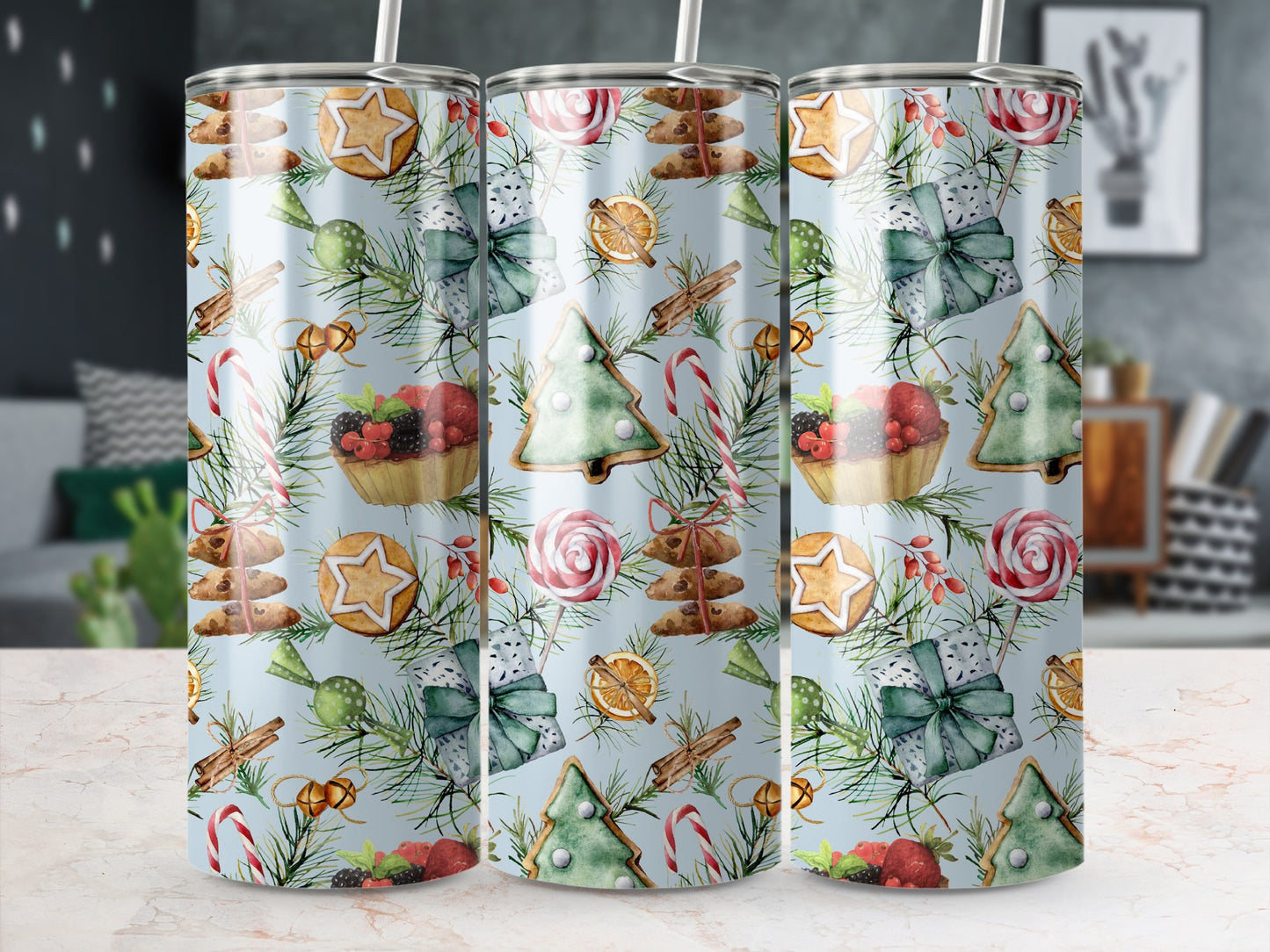 Christmas tumbler with cookies, berries, candy canes, and pine sprigs.
