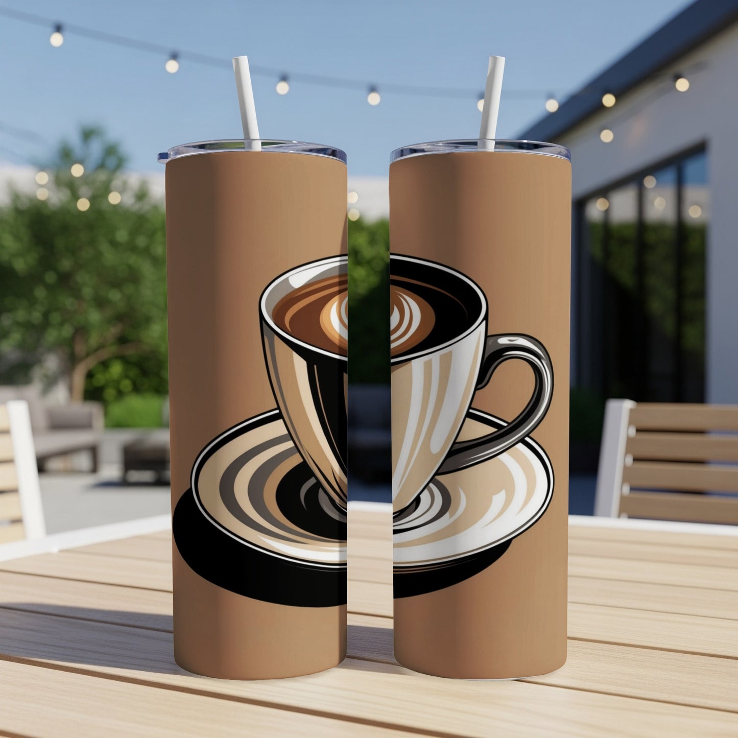 Two tumblers with latte art coffee cup design and straw, outdoors.