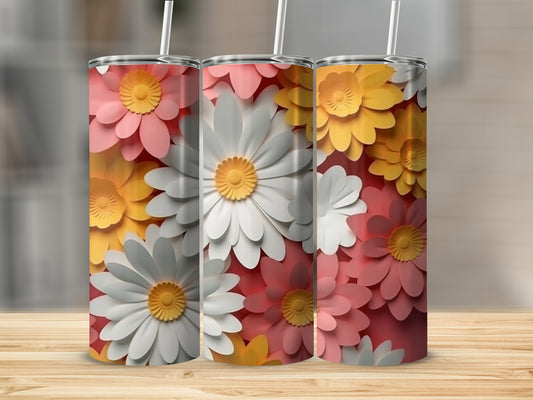 Three tumblers featuring floral designs in pink, white, and yellow on a wooden surface.