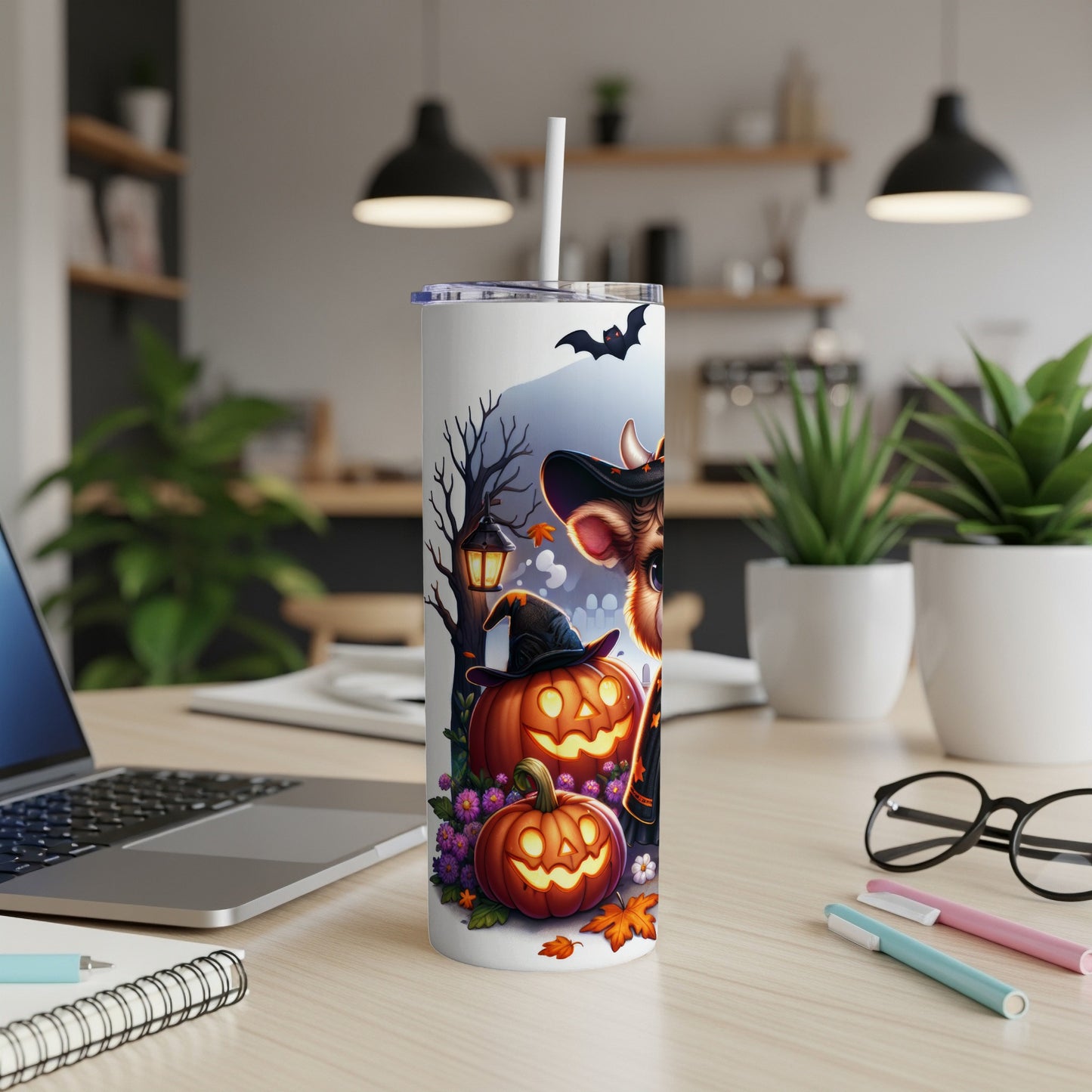 Halloween tumbler with pumpkins, a deer in a witch hat, and bats.