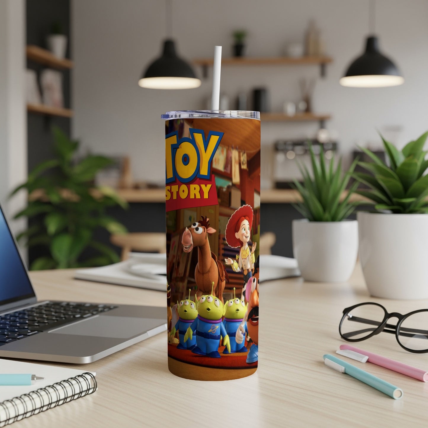 Toy Story tumbler with Woody, Jessie, and alien characters.