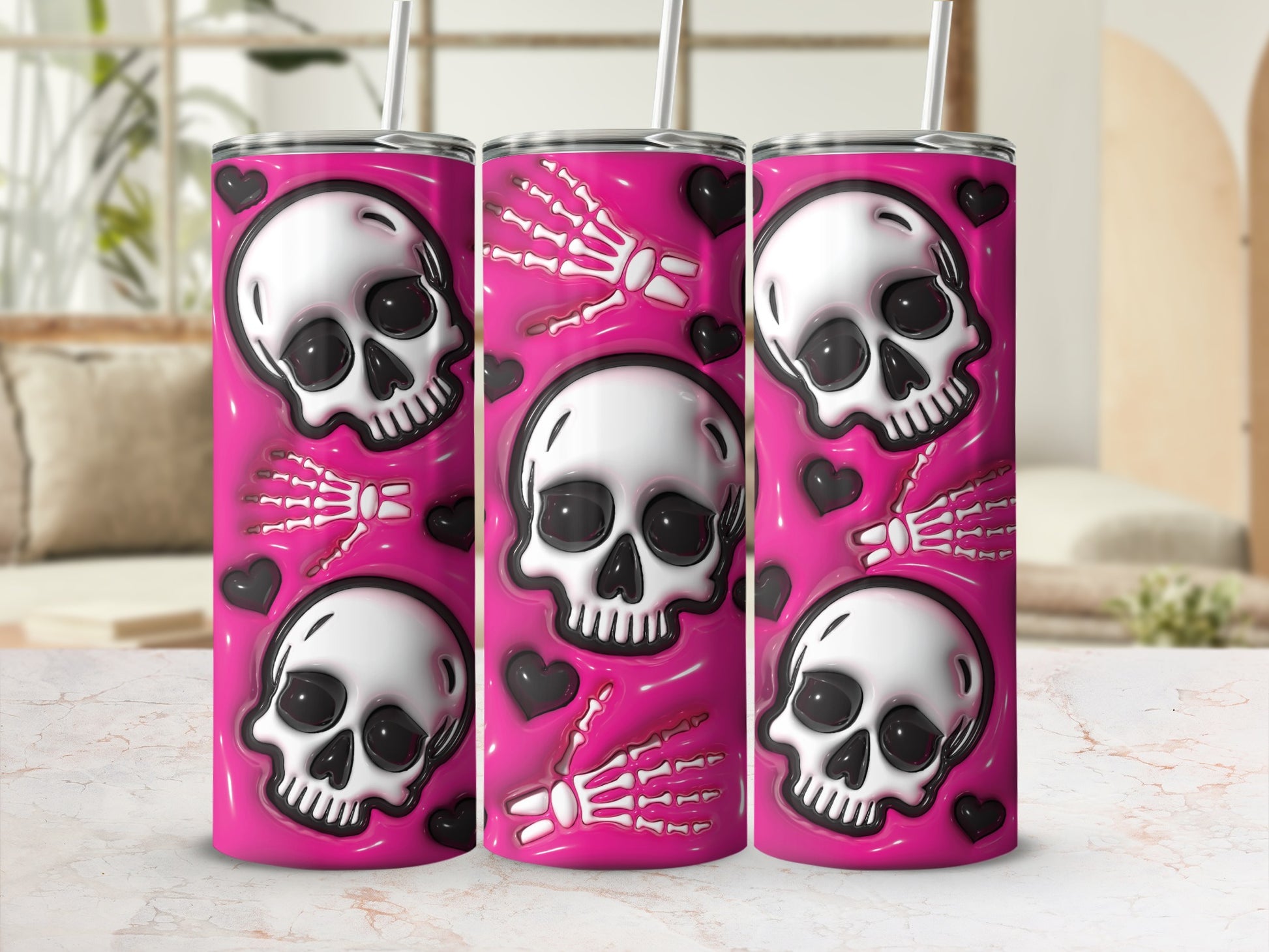 Three stainless steel tumblers with skulls, skeletons, and hearts design.