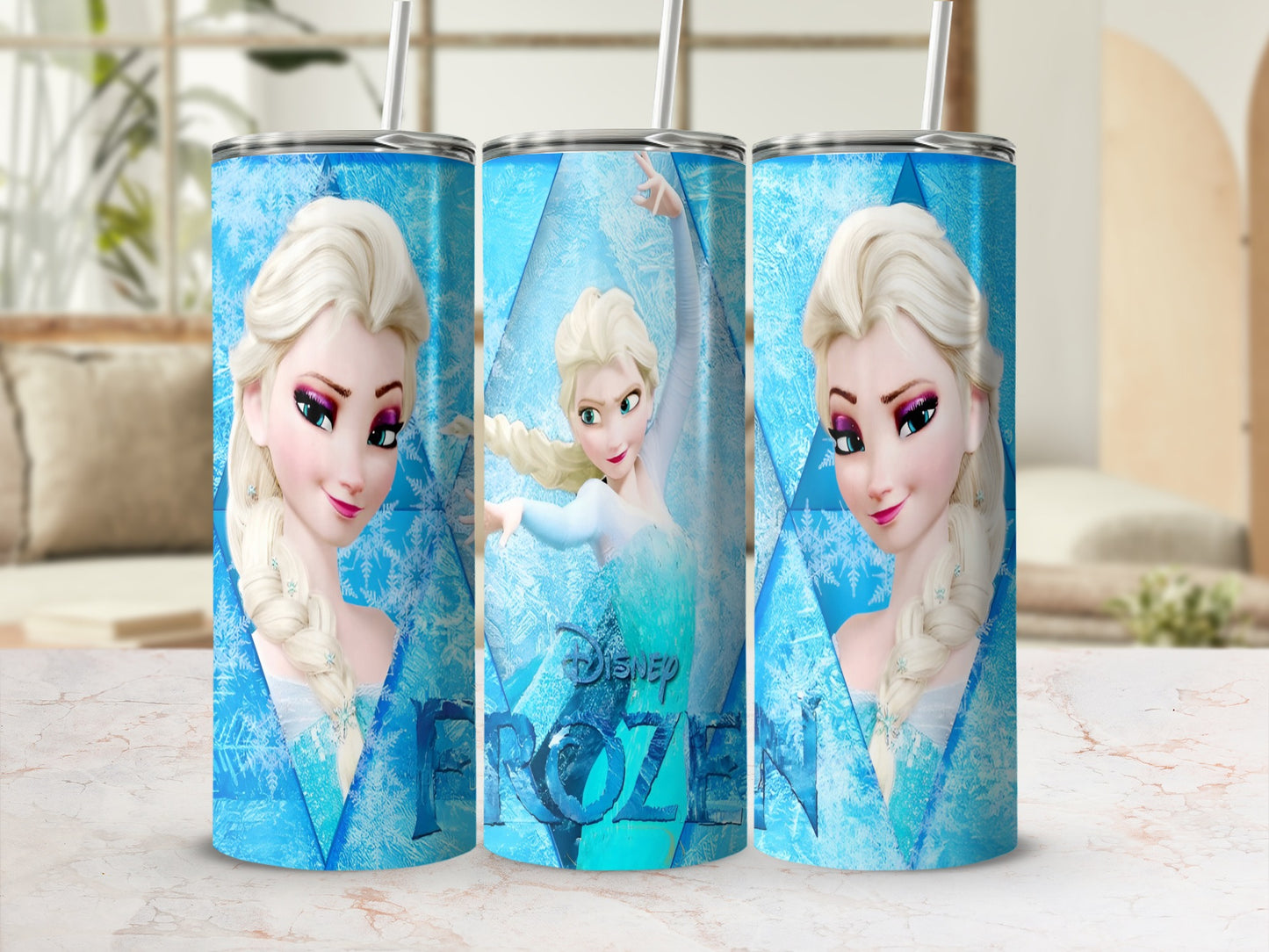 Elsa from Frozen on a blue ice-themed tumbler with straws.
