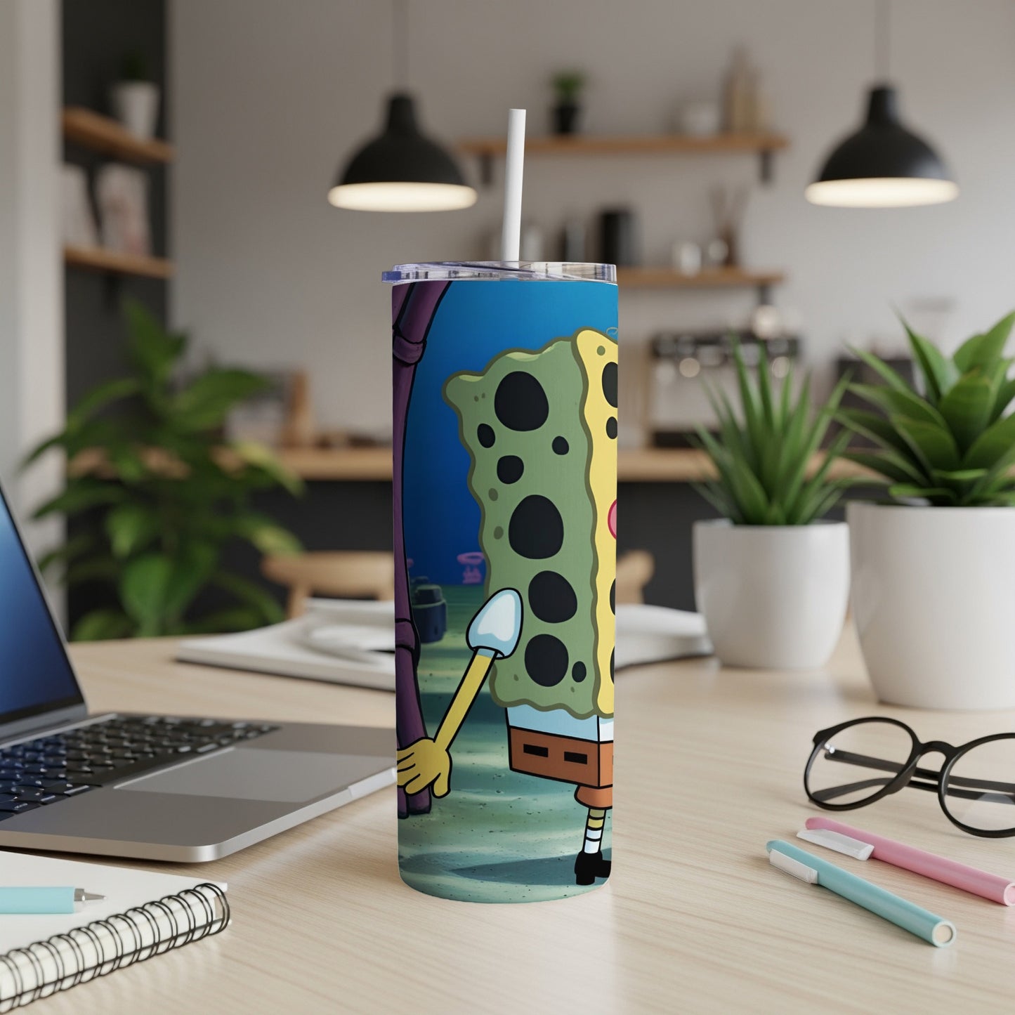 SpongeBob SquarePants character on a tumbler with a straw.