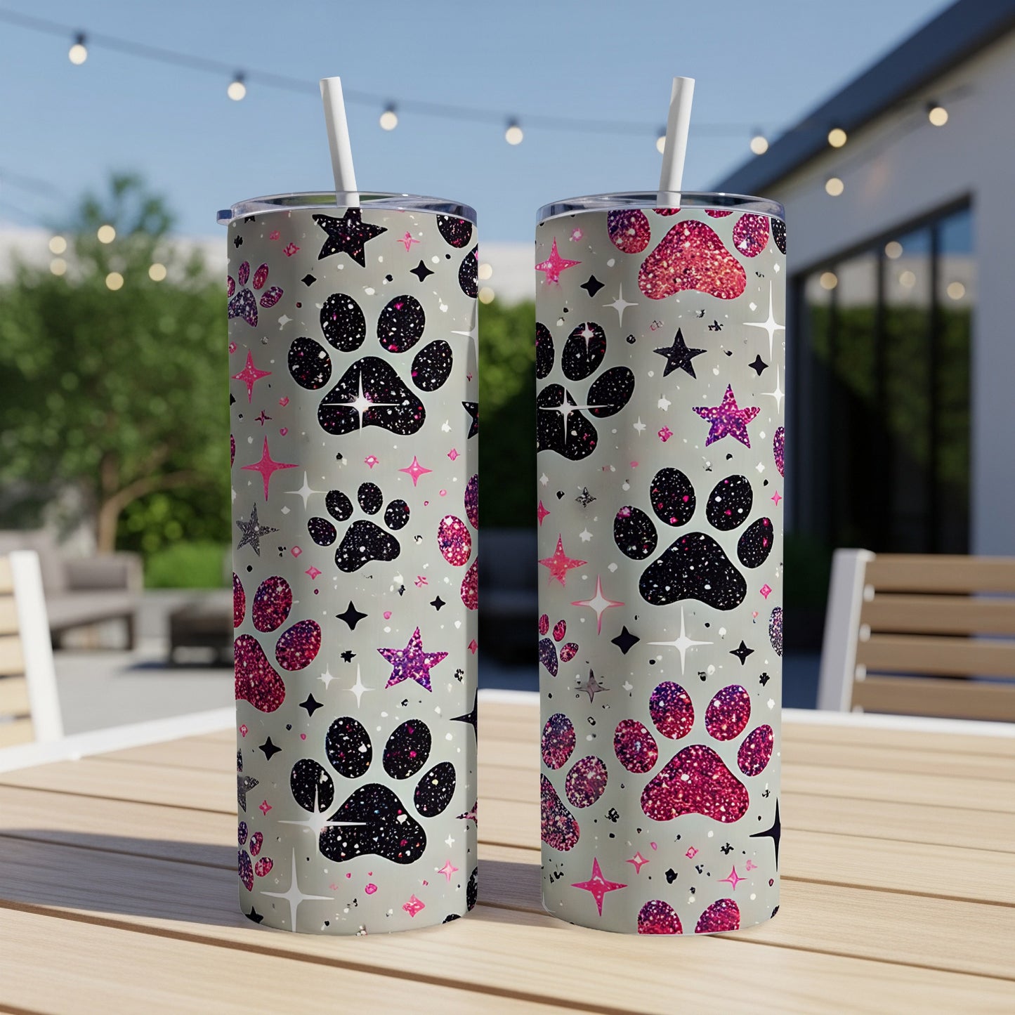 Two grey tumblers with paw prints and glitter stars pattern.