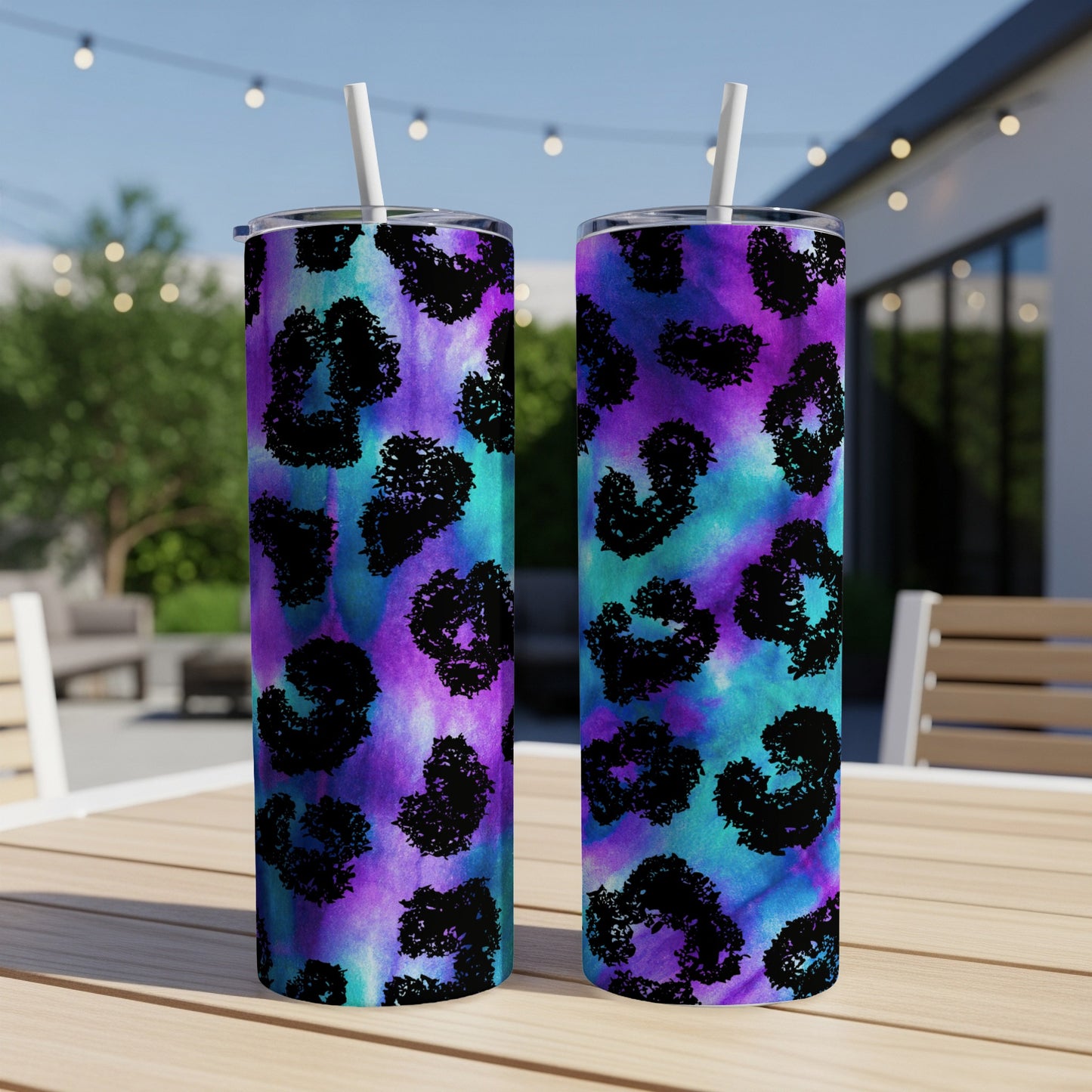 Two tumblers with black leopard print on a purple and blue tie-dye background.