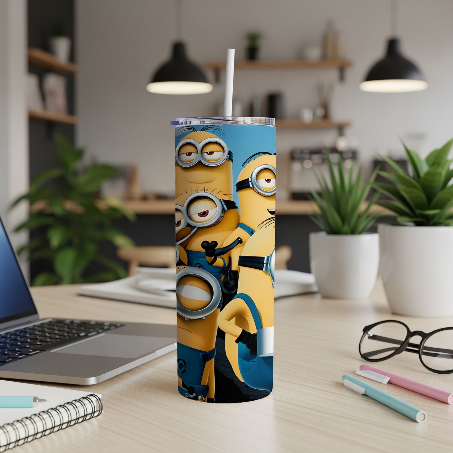 Minions Stuart, Kevin, and Bob smiling on a blue tumbler.