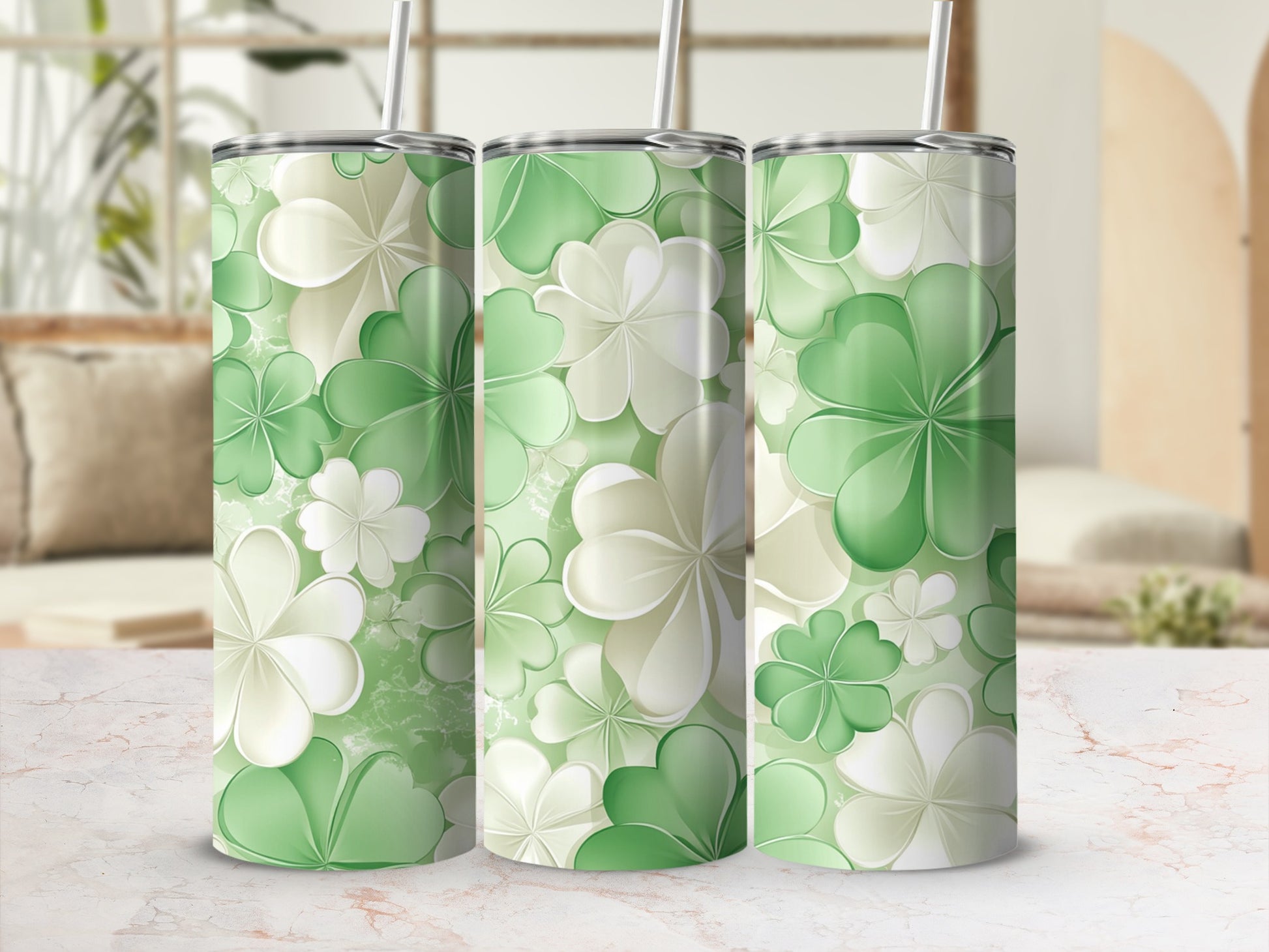 Three tumblers with a green and white clover design.