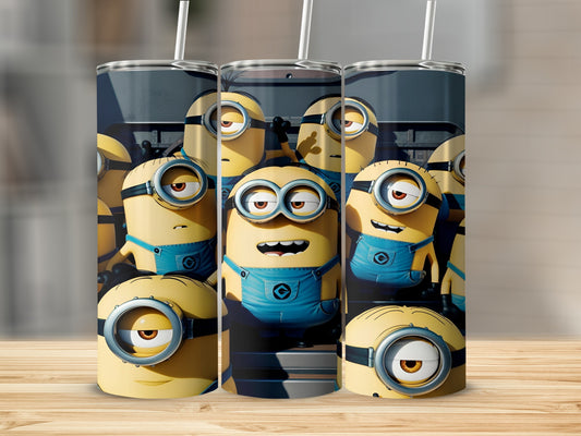 Three Minions characters with blue overalls on a tall cylindrical tumbler.