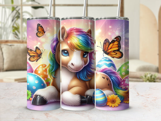 Cartoon unicorn with rainbow mane, surrounded by Easter eggs and butterflies.
