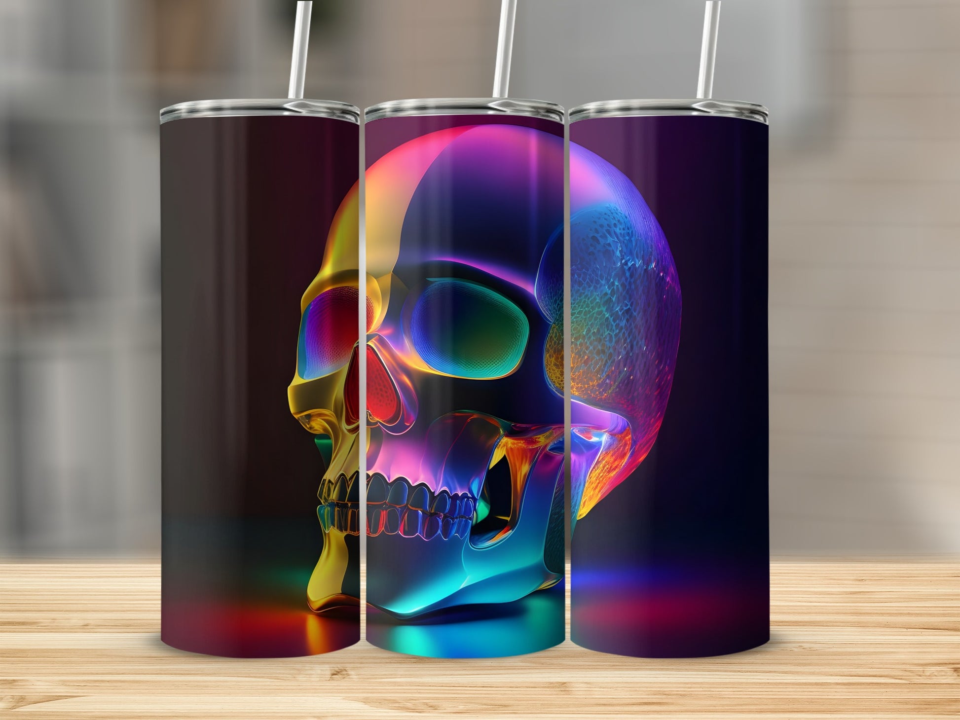 Three iridescent tumblers with colorful skull designs displayed on a wooden surface.