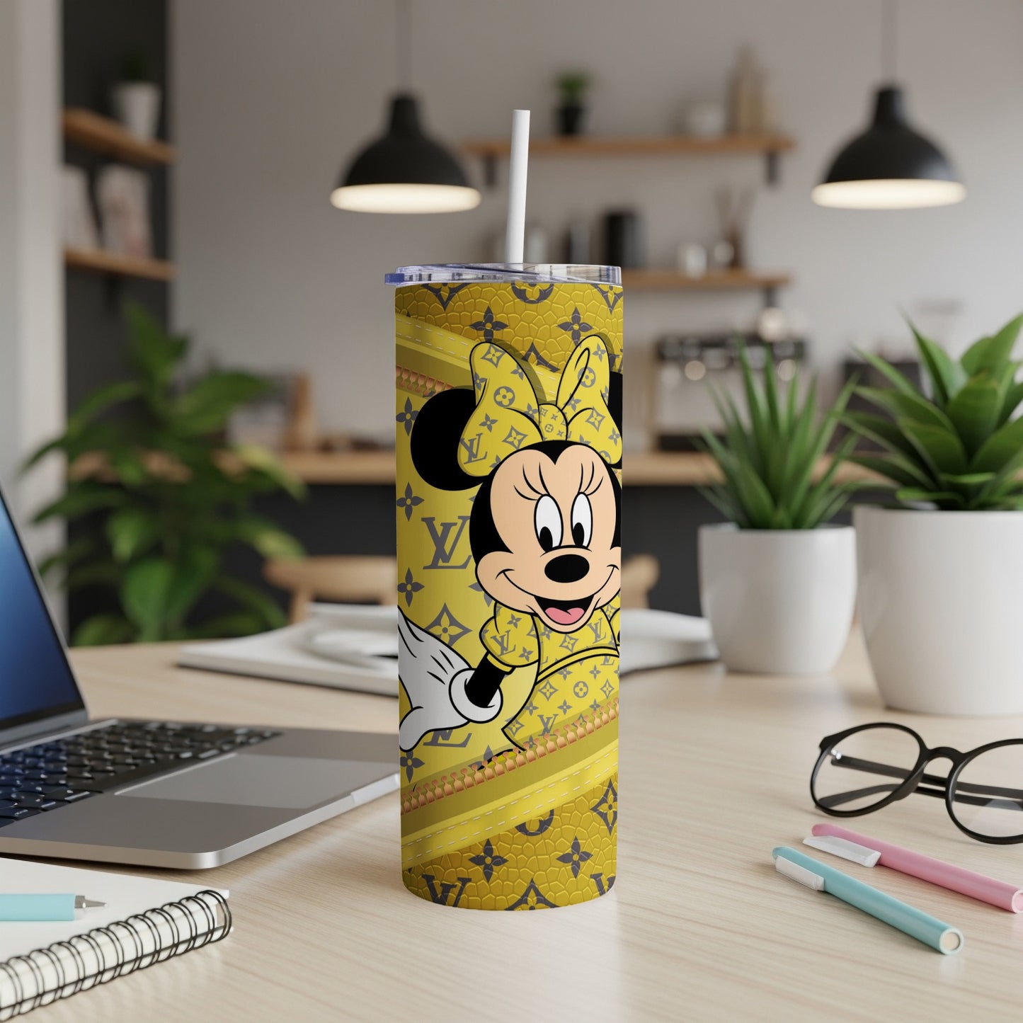 Minnie Mouse on a yellow tumbler with LV-inspired pattern and straw.