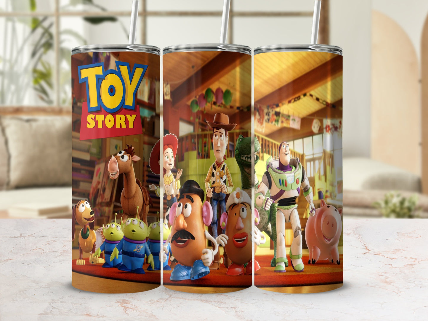 Toy Story characters on a tumbler with straw, showing Woody, Buzz Lightyear, Mr. Potato Head, and more.