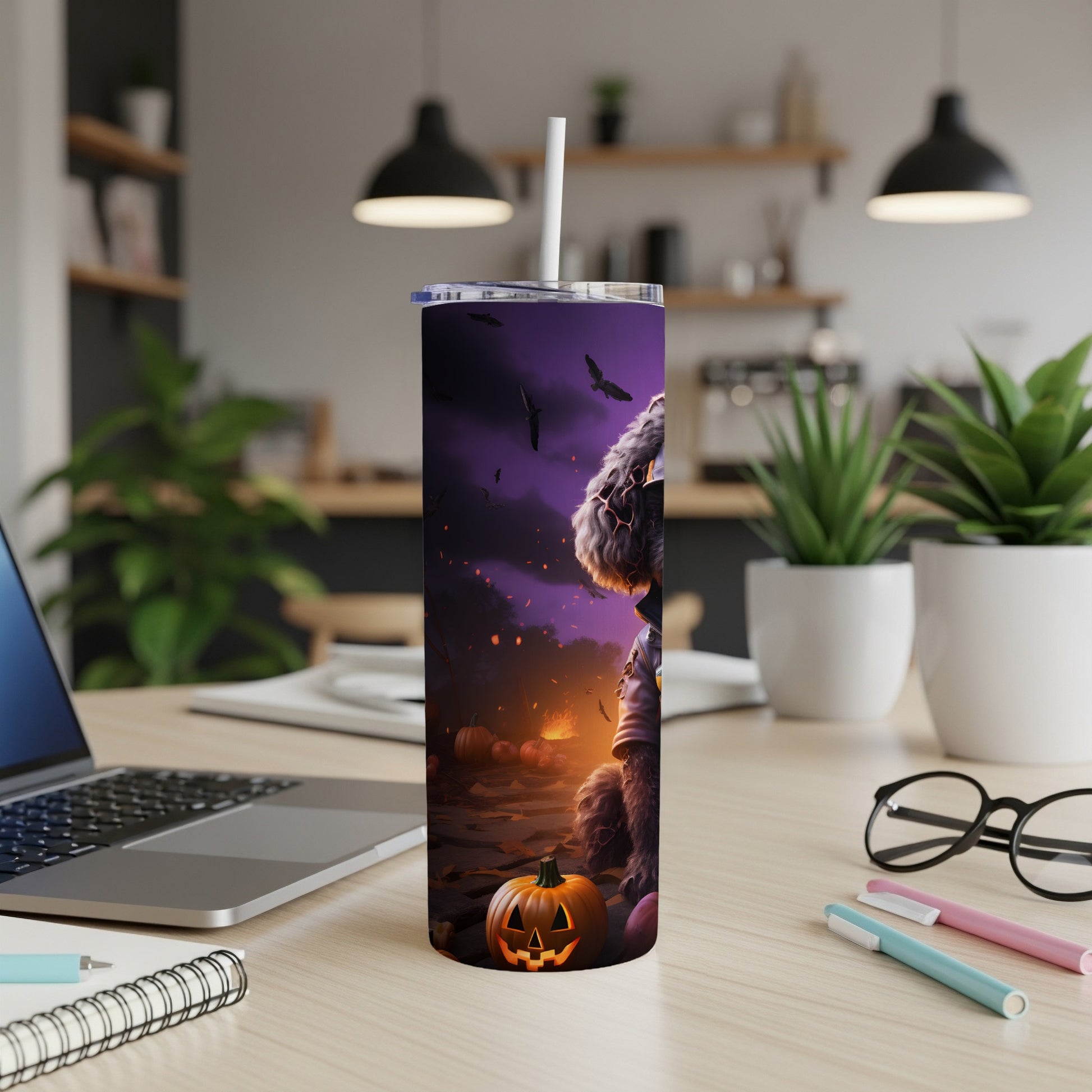 Halloween tumbler with spooky dog, pumpkins, and flying bats against a purple sky.