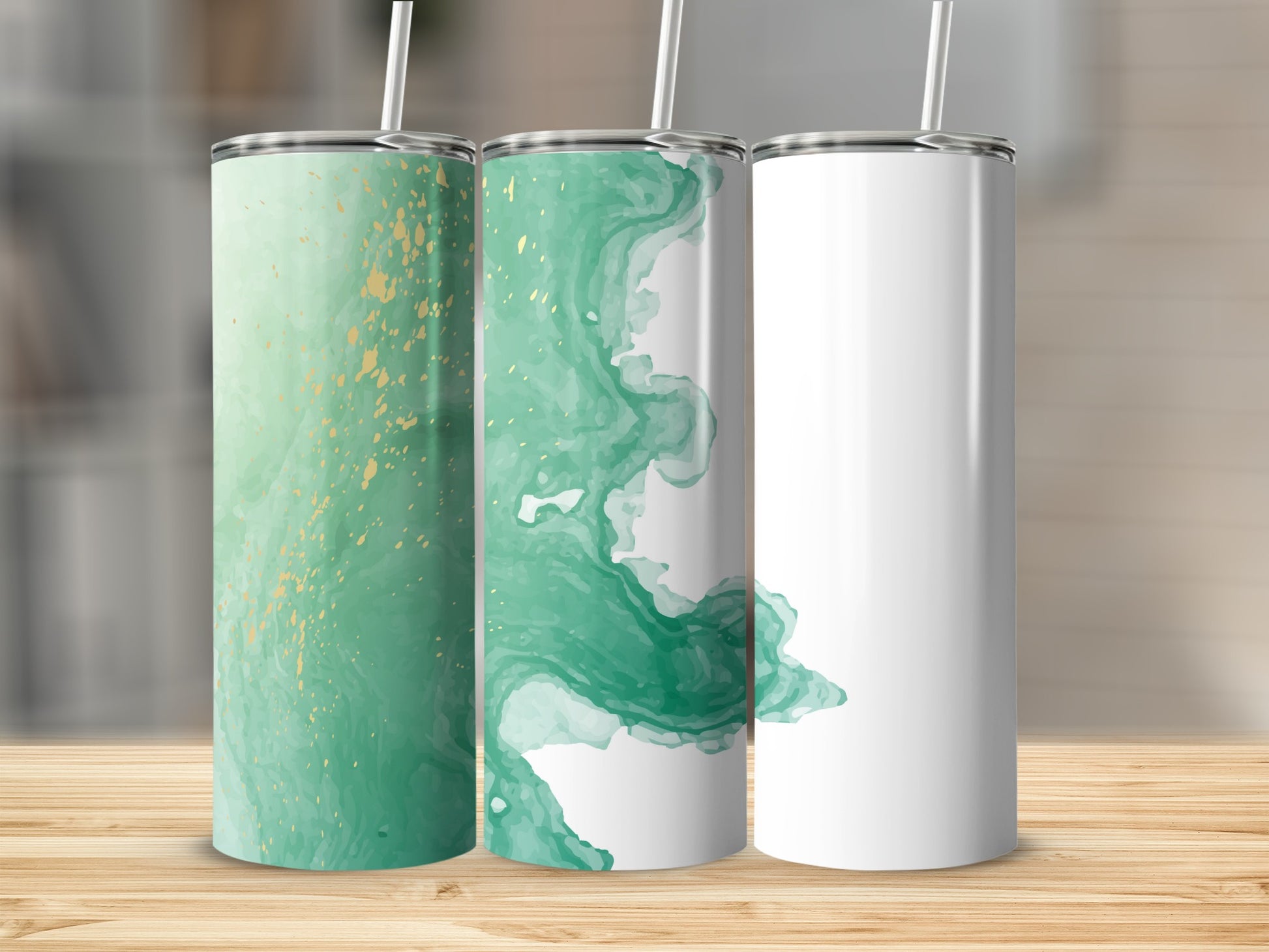 Three tumblers with green watercolor and gold accents, one blank.