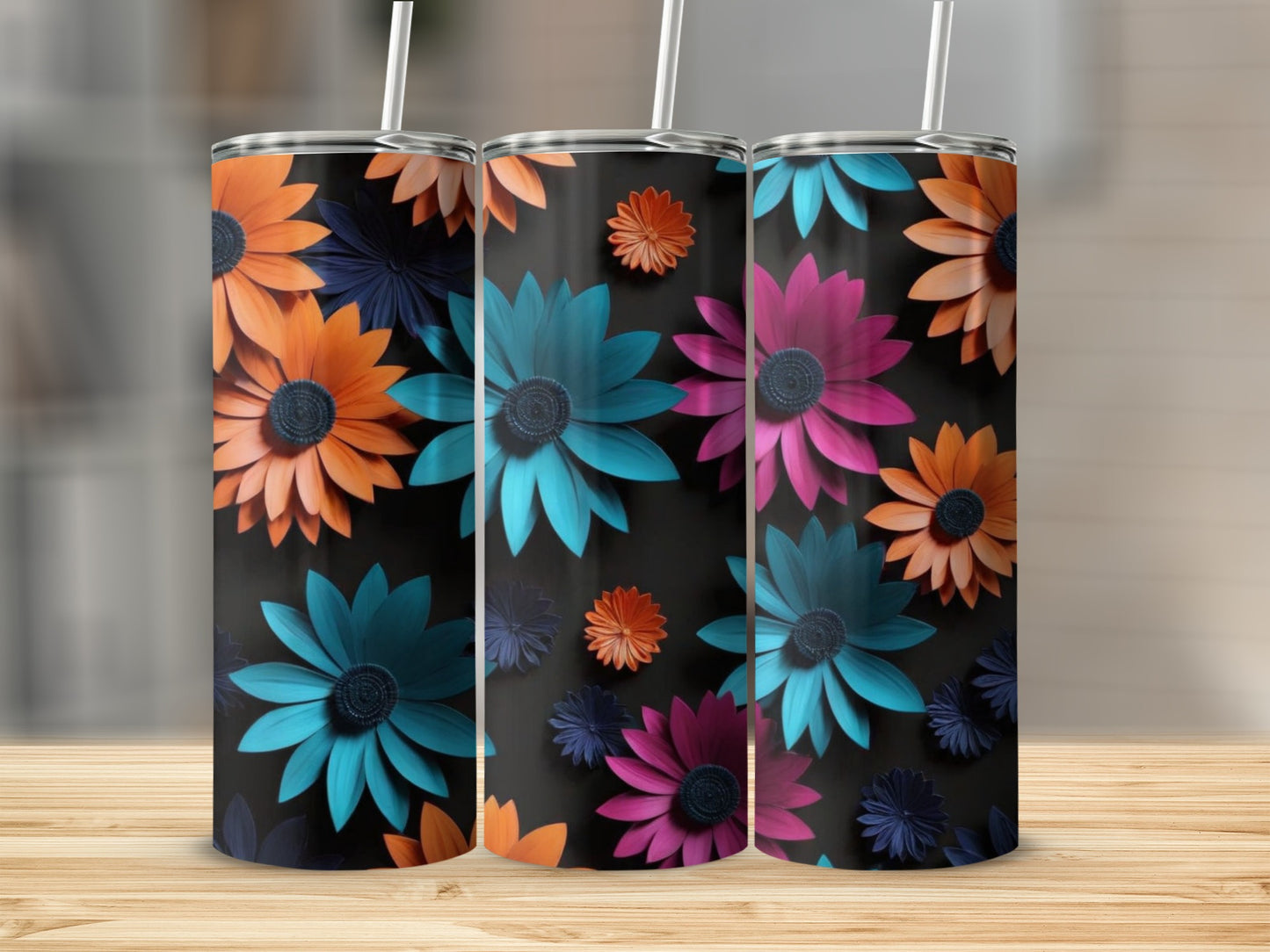 Three tumblers with black backgrounds and colorful floral designs.