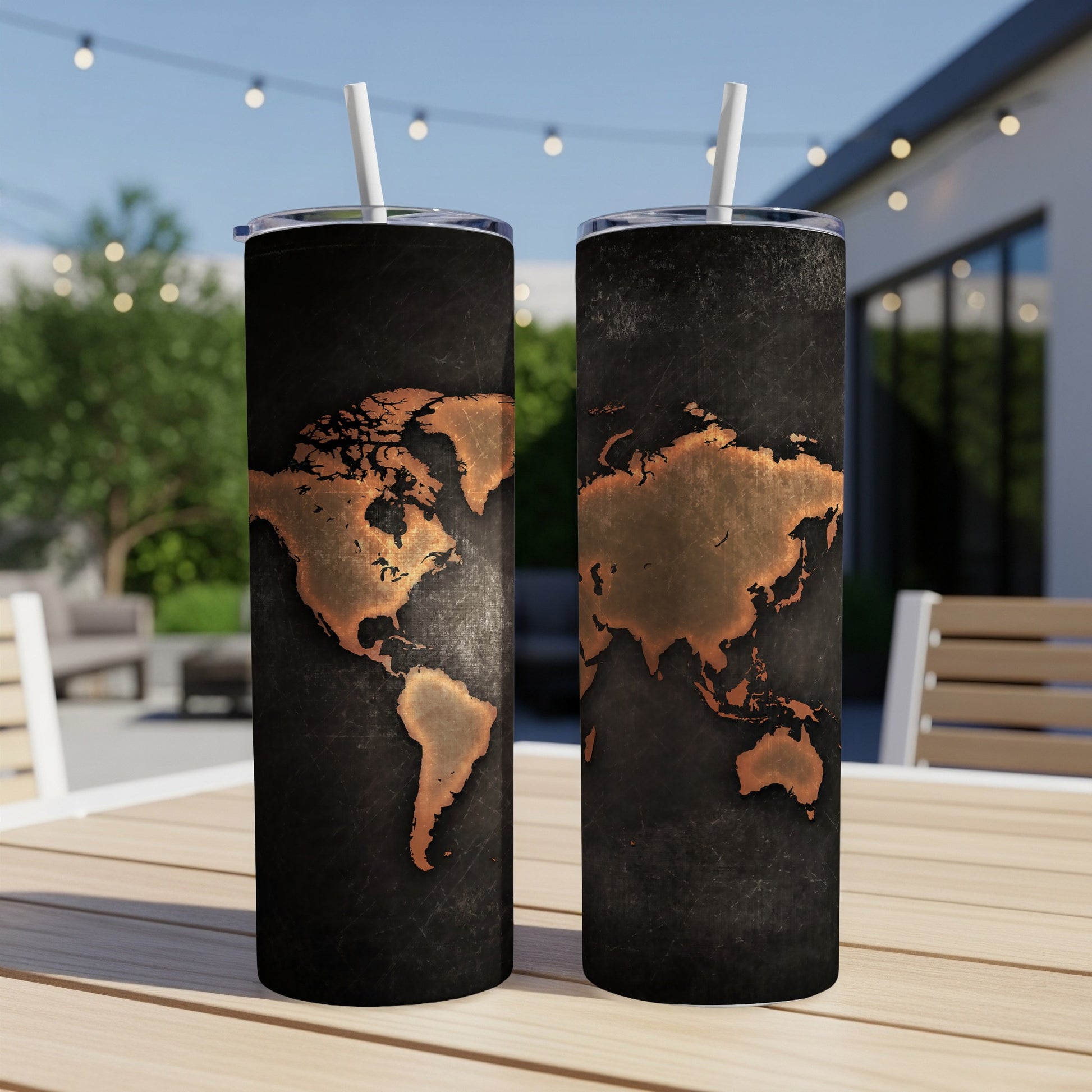 Two tumblers with vintage copper world map design on a dark textured background.