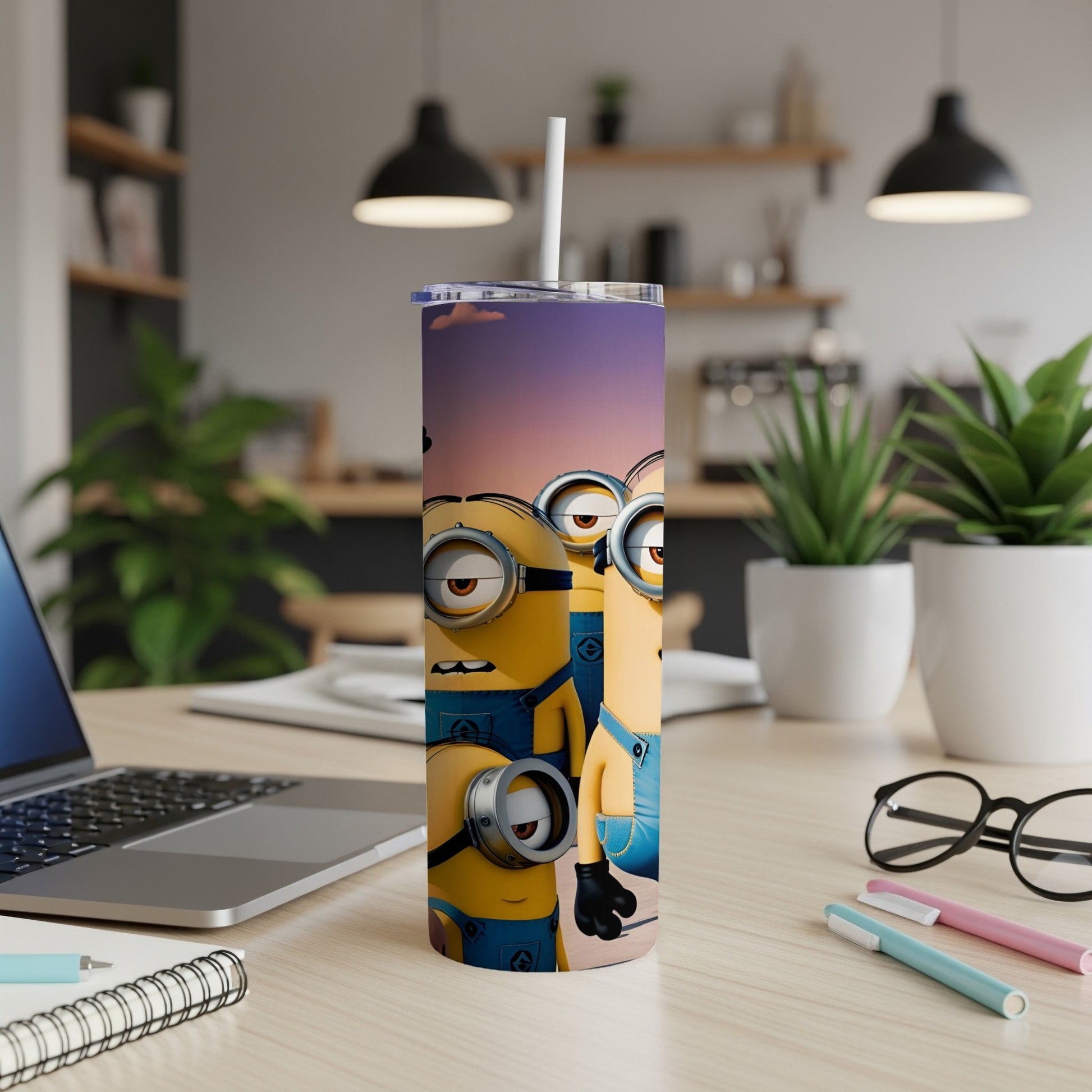 Minions Stuart and Kevin on a tumbler with a straw, on a desk.