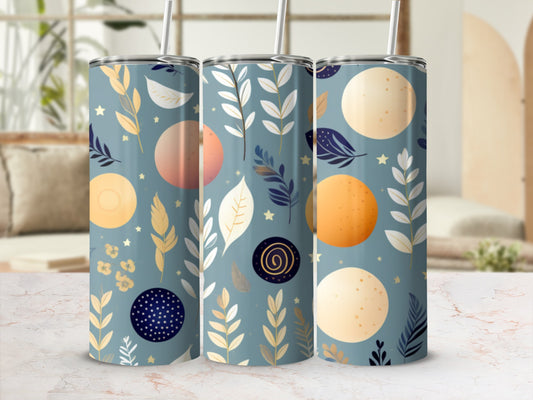 Three tumblers with celestial moon and leaf pattern on a light marble surface.