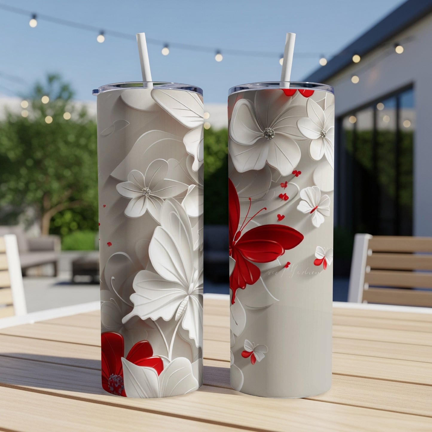 Two tall tumblers with a red butterfly and floral design.
