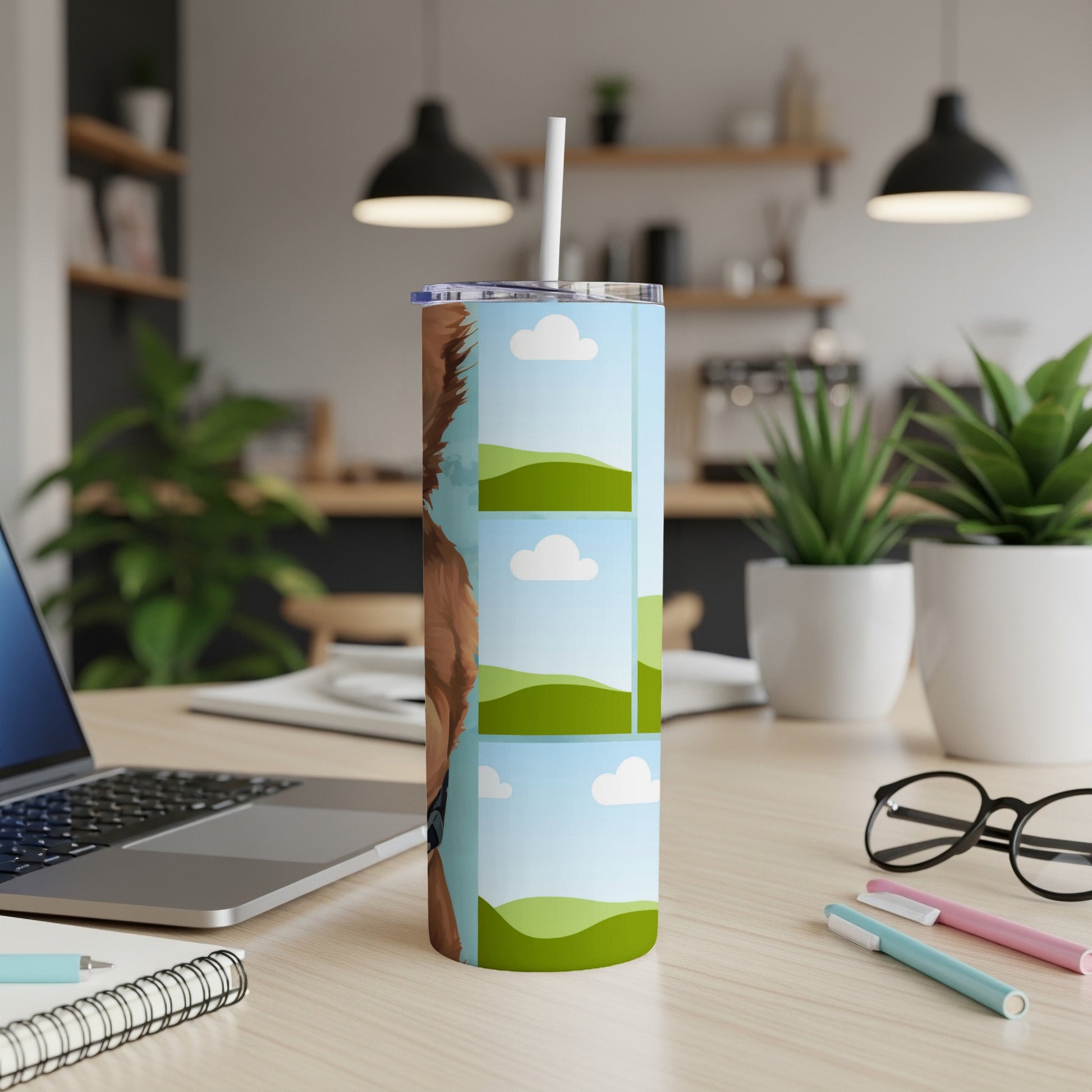 Tumbler with a dog's face and multiple landscape photos.