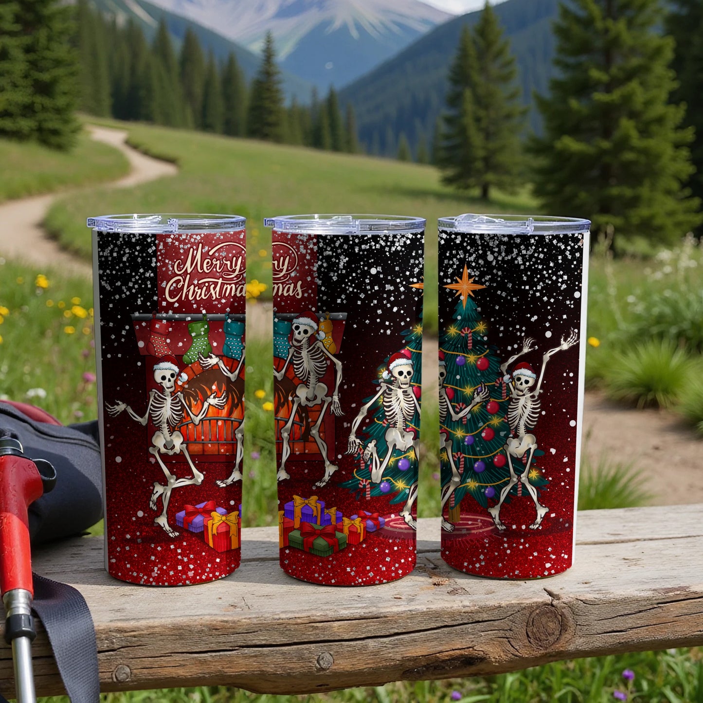 Three tumblers with skeletons celebrating Christmas in a snowy forest scene.