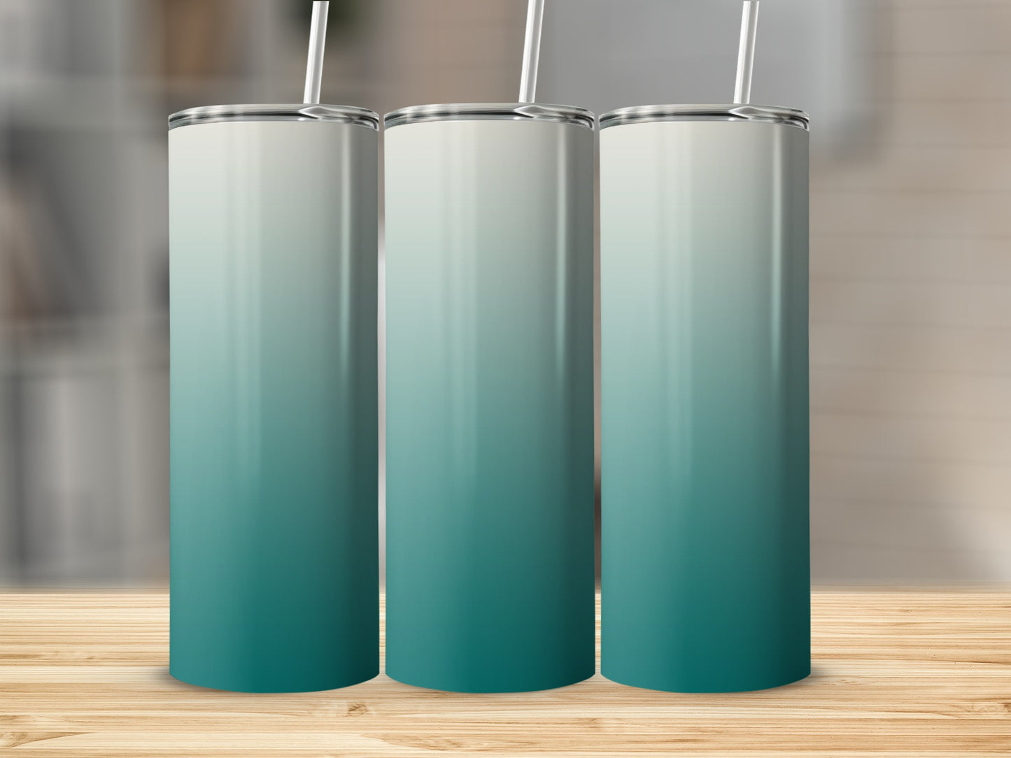 Three tall tumblers with a gradient from white to teal on a wooden surface.