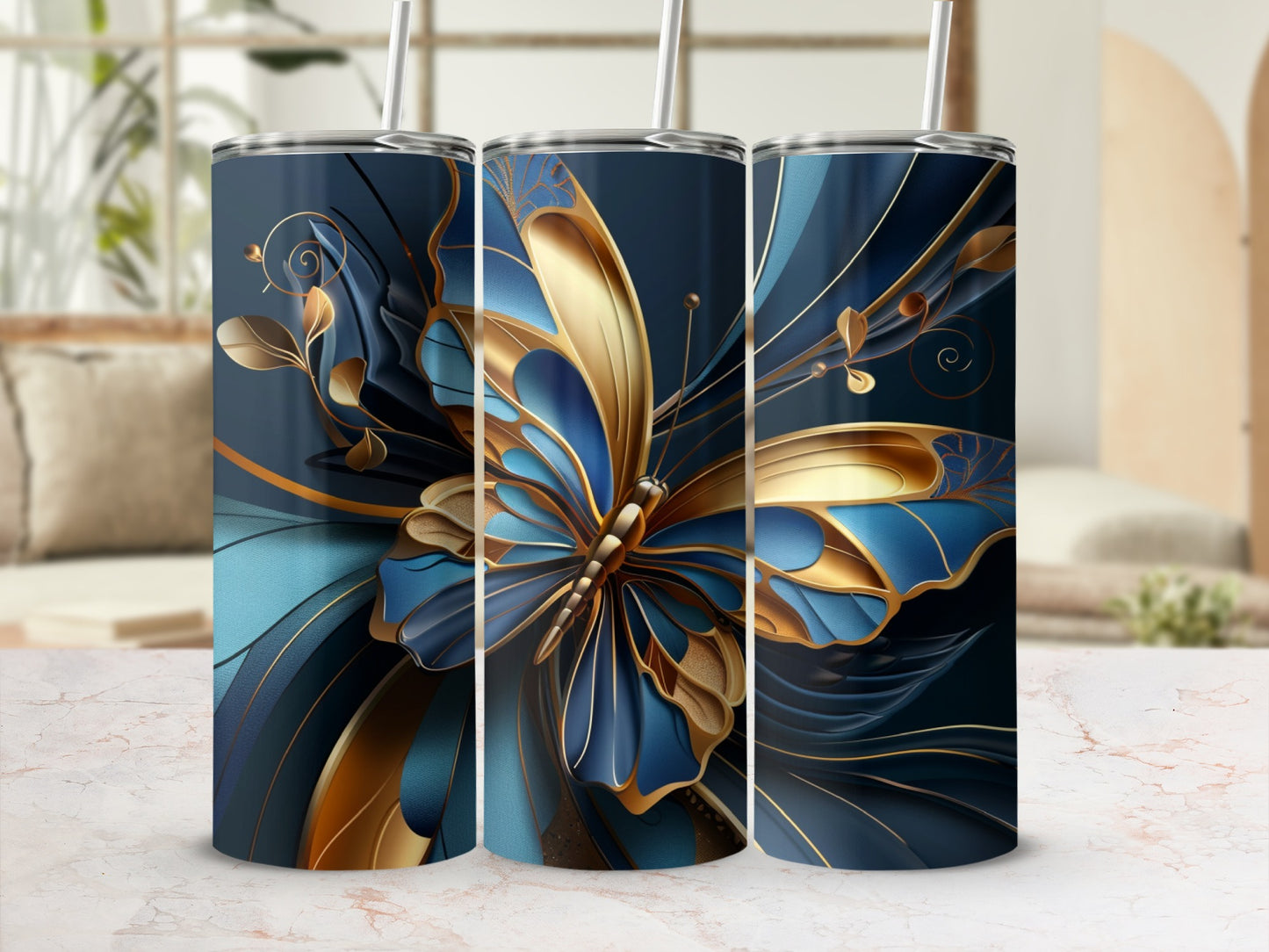 Blue and gold butterfly design on three tall tumblers.