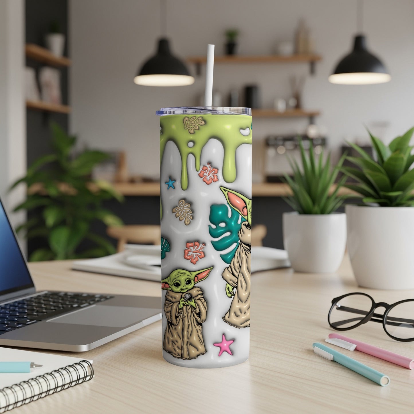 Green and white tumbler with Grogu and floral designs.