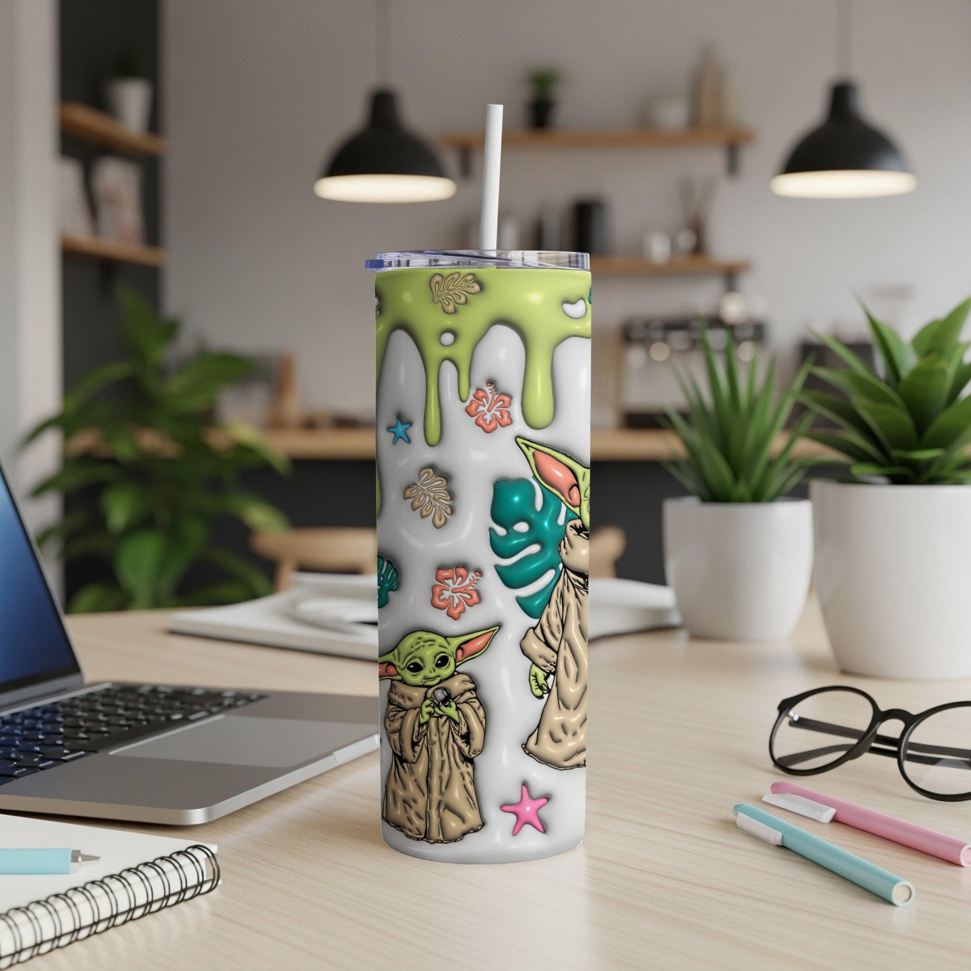 Green and white tumbler with Grogu and floral designs.
