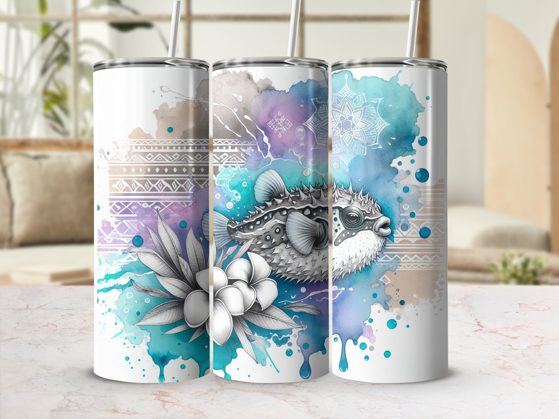 Three tumblers with watercolor pufferfish and floral designs.