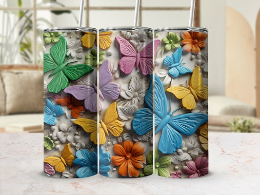 Three tumblers featuring embossed colorful butterflies and flowers.