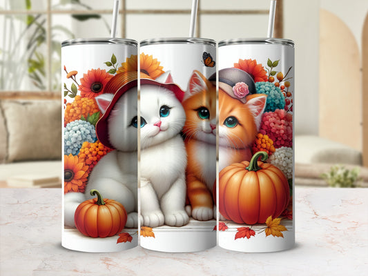 Two kittens with pumpkins and flowers on insulated tumblers.