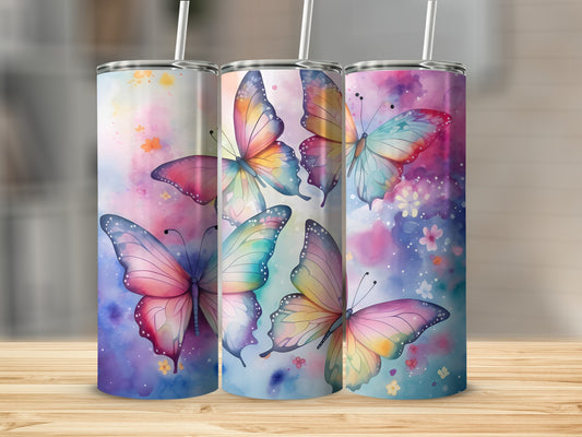Three tumblers featuring colorful watercolor butterflies and floral accents.