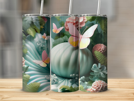 Mint green tumbler with floral and butterfly design.