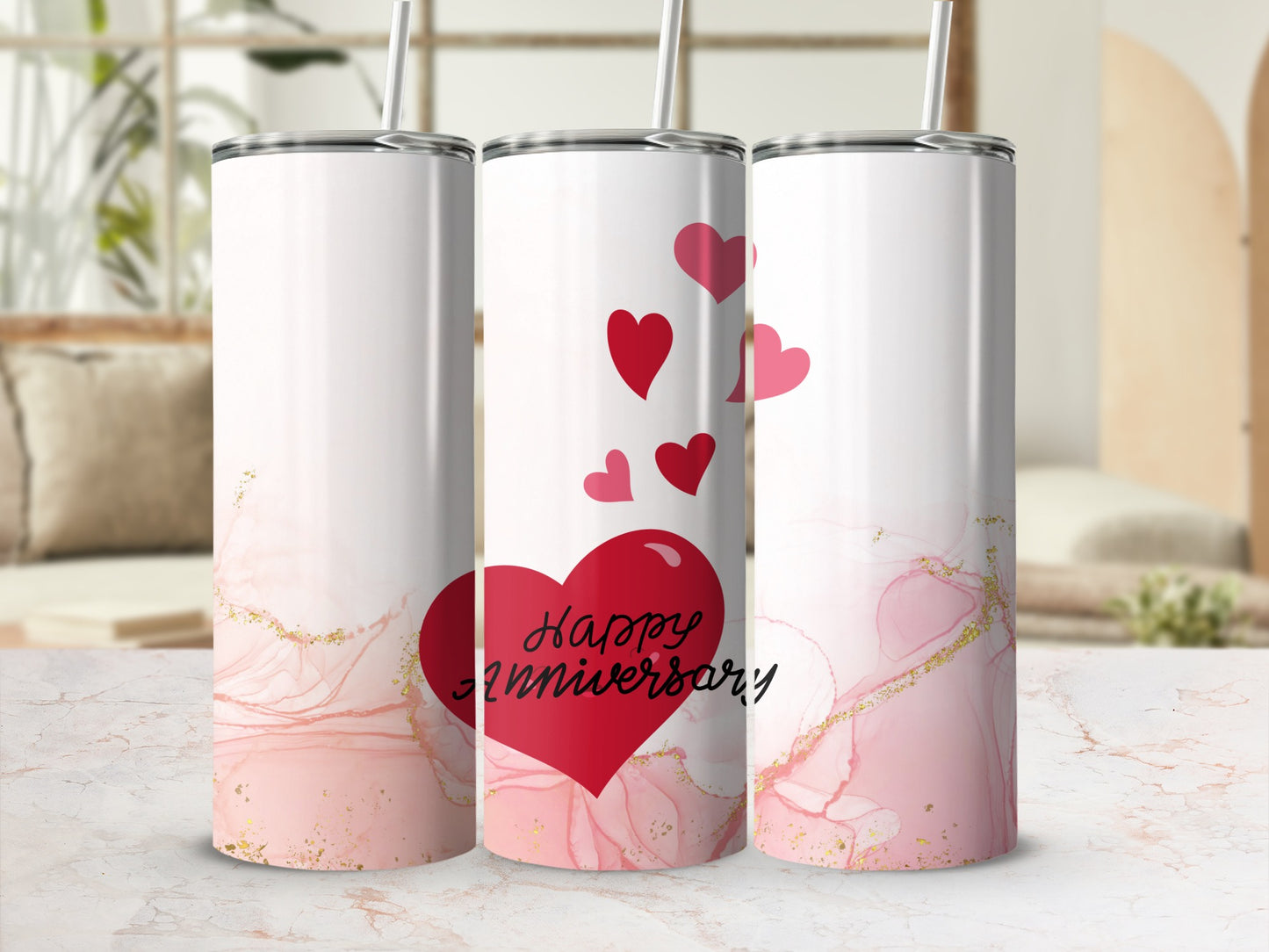 Tumbler with red hearts and "Happy Anniversary" text on pink marbled background.