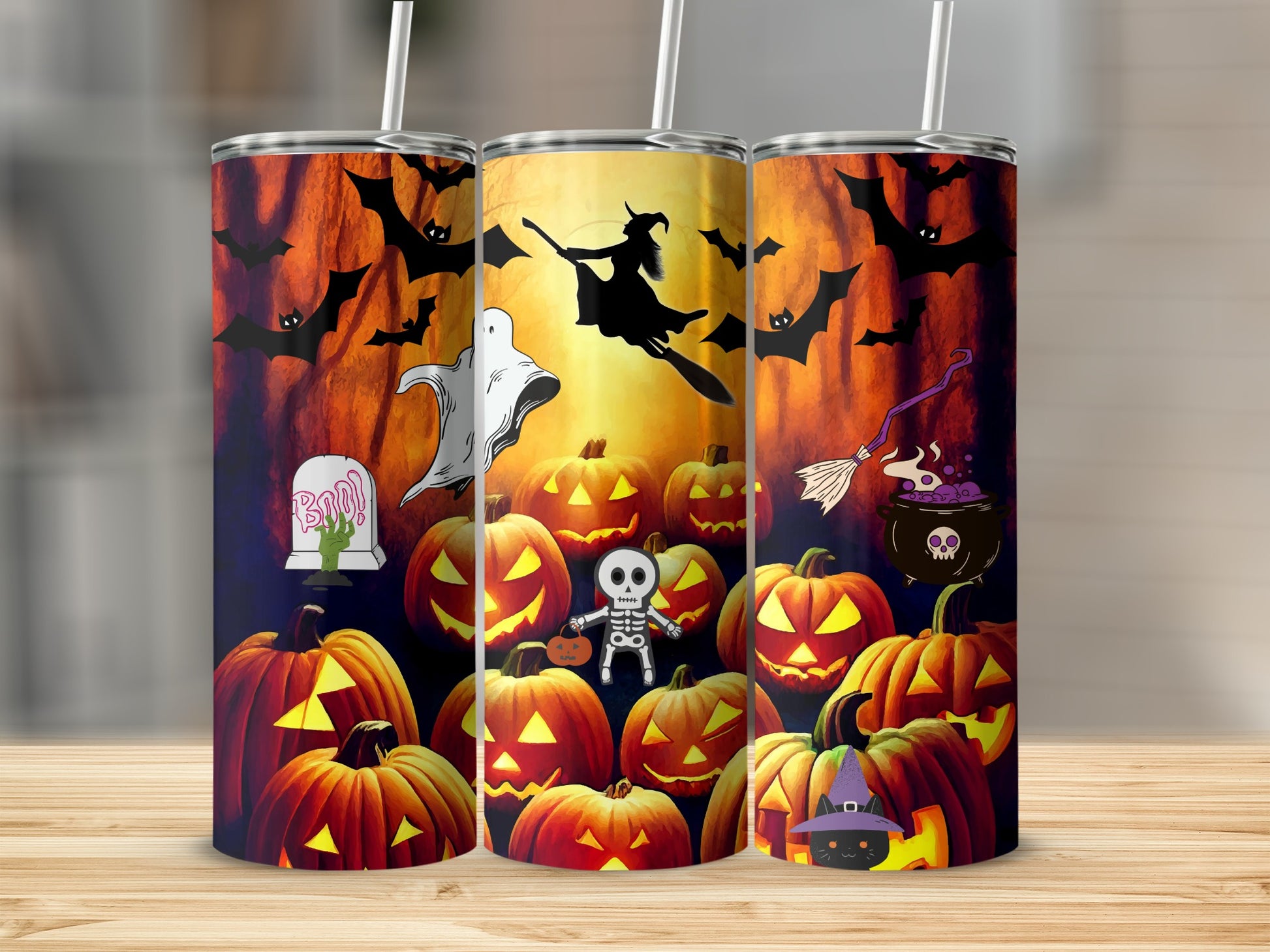Three Halloween-themed tumblers with pumpkins, bats, a ghost, witch, skeleton, and black cat.