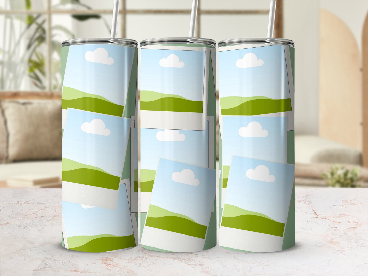 Three tumblers with a landscape photo collage design and straws.