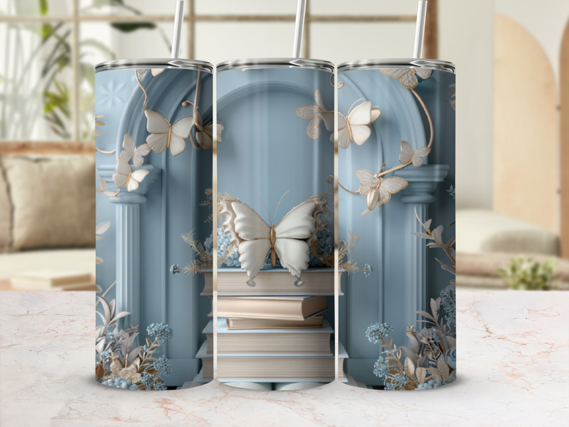 Pale blue tumbler with stacked books and golden butterflies.