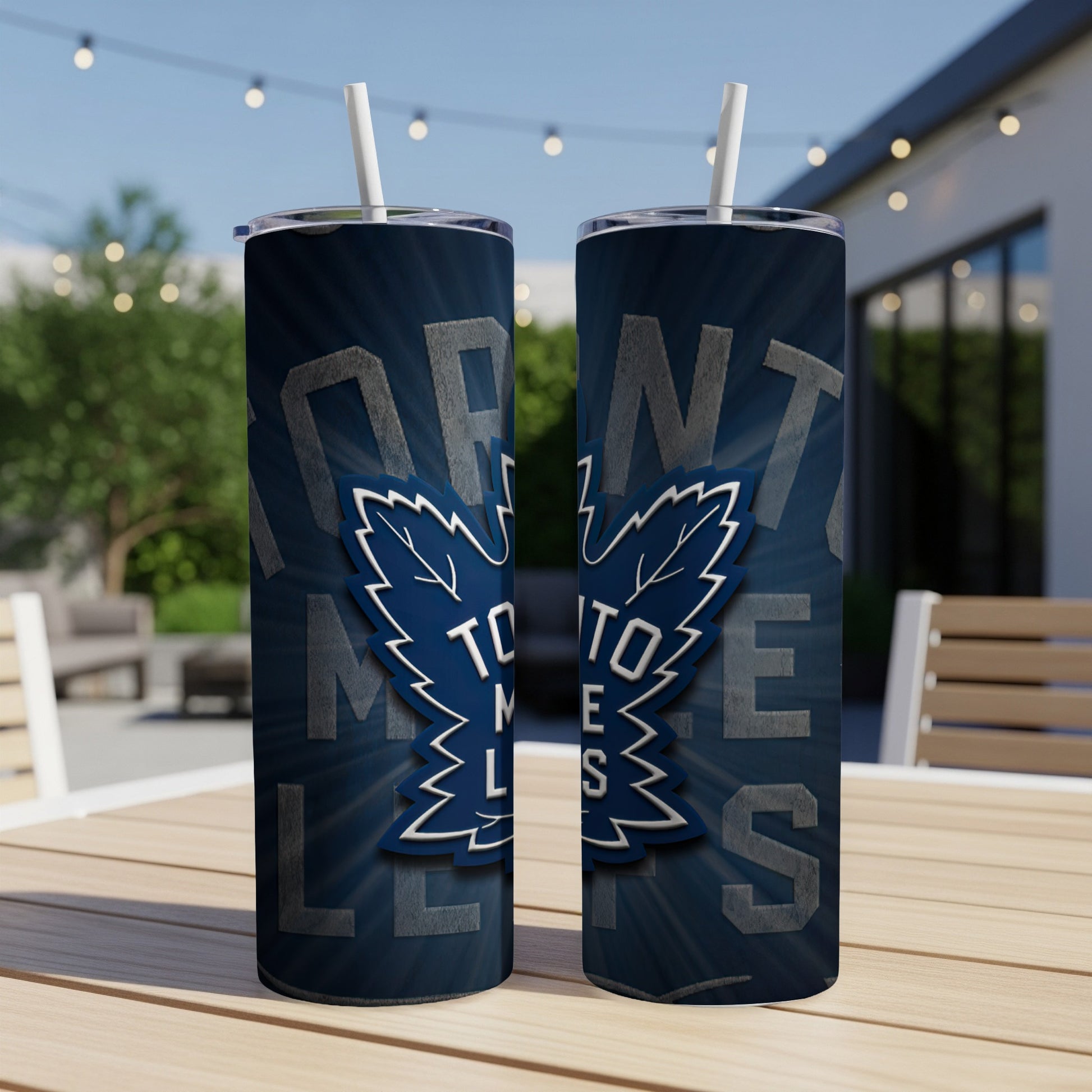 Toronto Maple Leafs logo on dark blue stainless steel tumblers with straws.