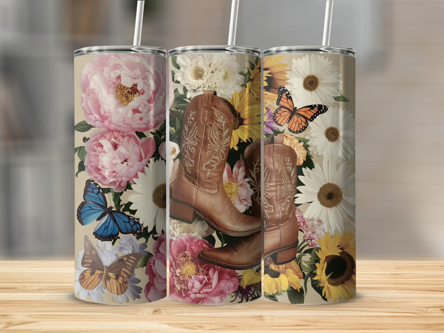 Cowboy boots and flowers on three tumblers with butterflies.