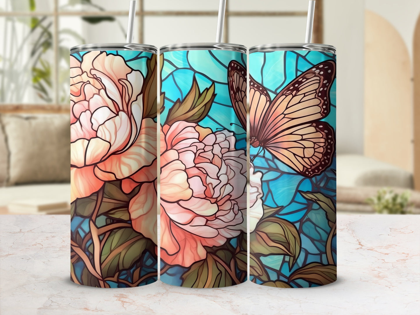 Three tumblers with floral and butterfly stained glass designs.