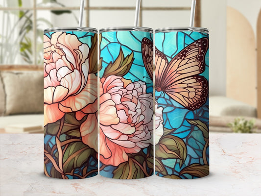 Three tumblers with floral and butterfly stained glass designs.